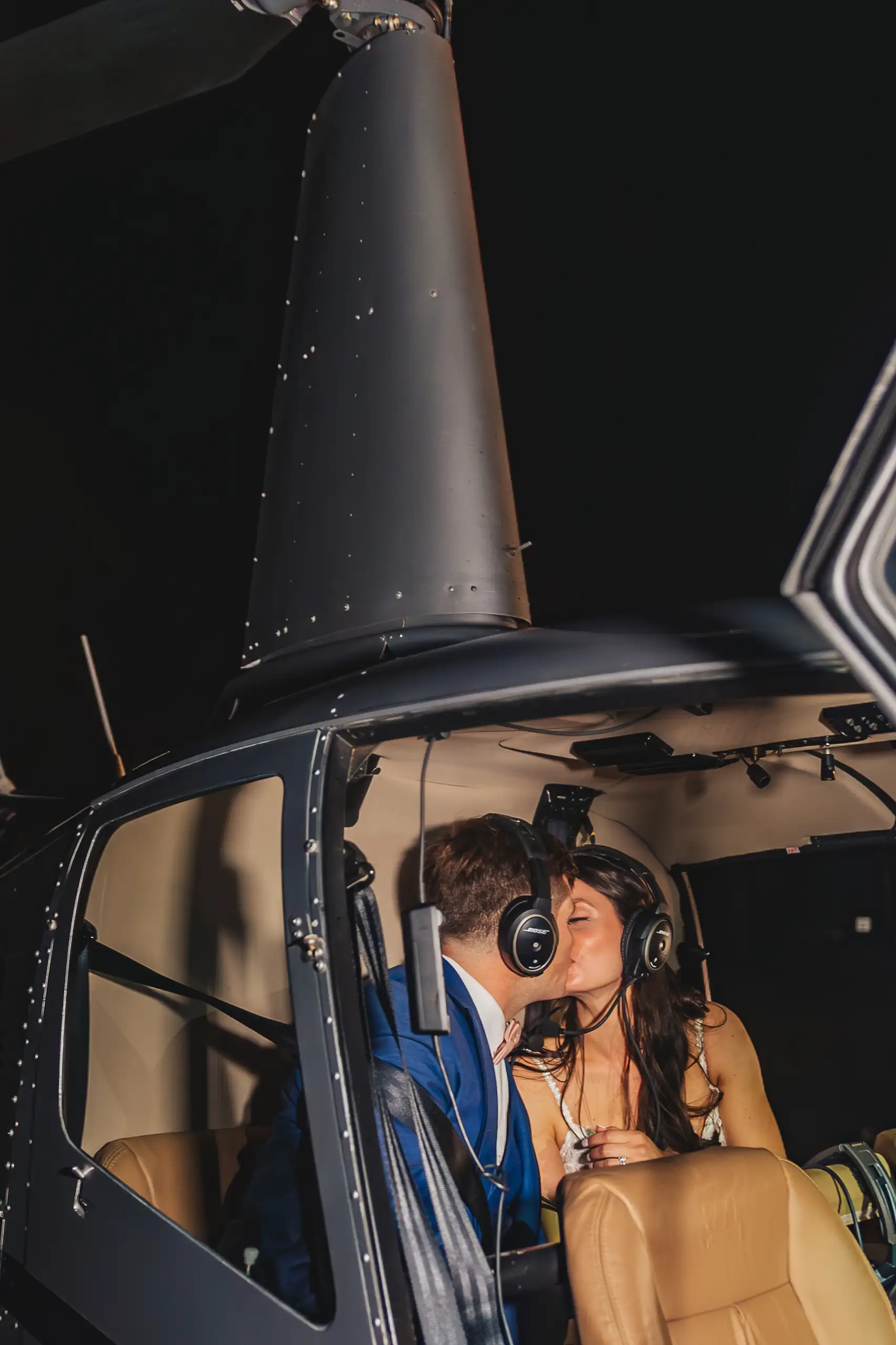 Send-Off: the two of them sitting in the helicopter, headsets on, at their wedding at Swan Lake Overlook in Dawsonville, GA