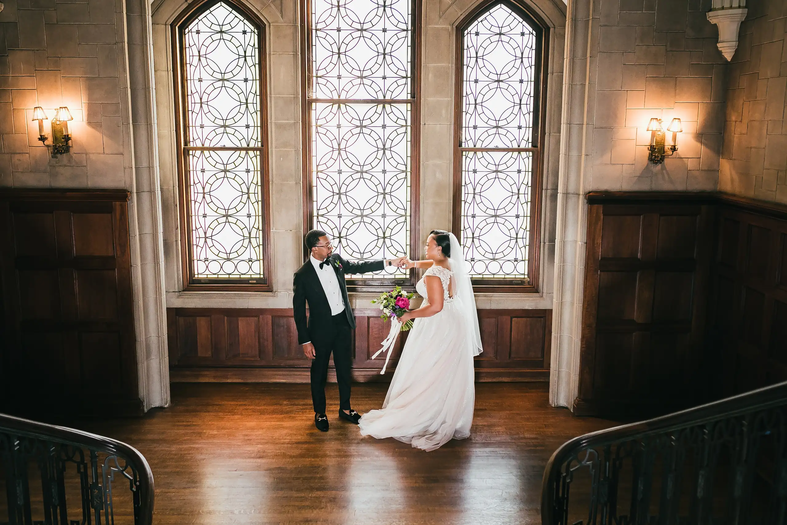 Wedding Formals: the couple alone in the panelled room below the tall windows, at their wedding at Callanwolde Fine Arts Center in Atlanta, GA
