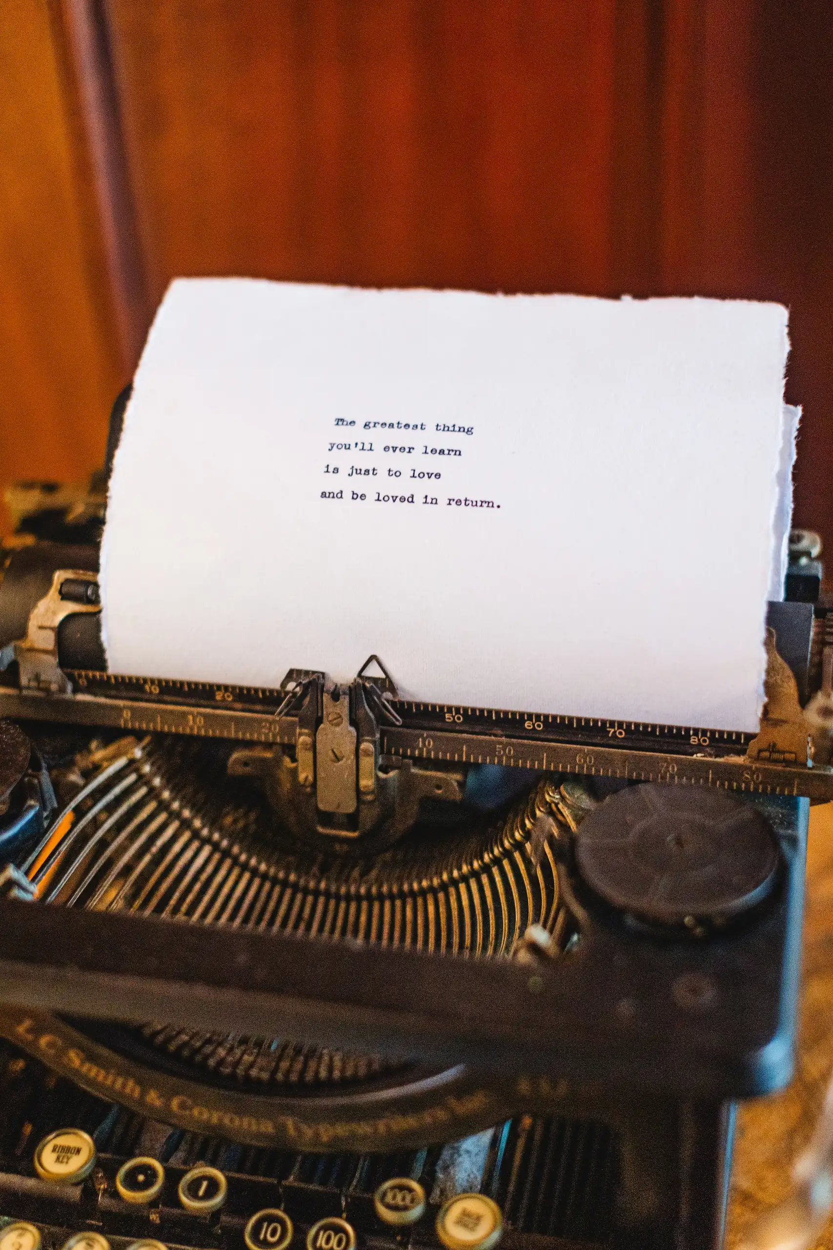 Reception Details: a note rolled into a vintage typewriter, at their wedding at Callanwolde Fine Arts Center in Atlanta, GA