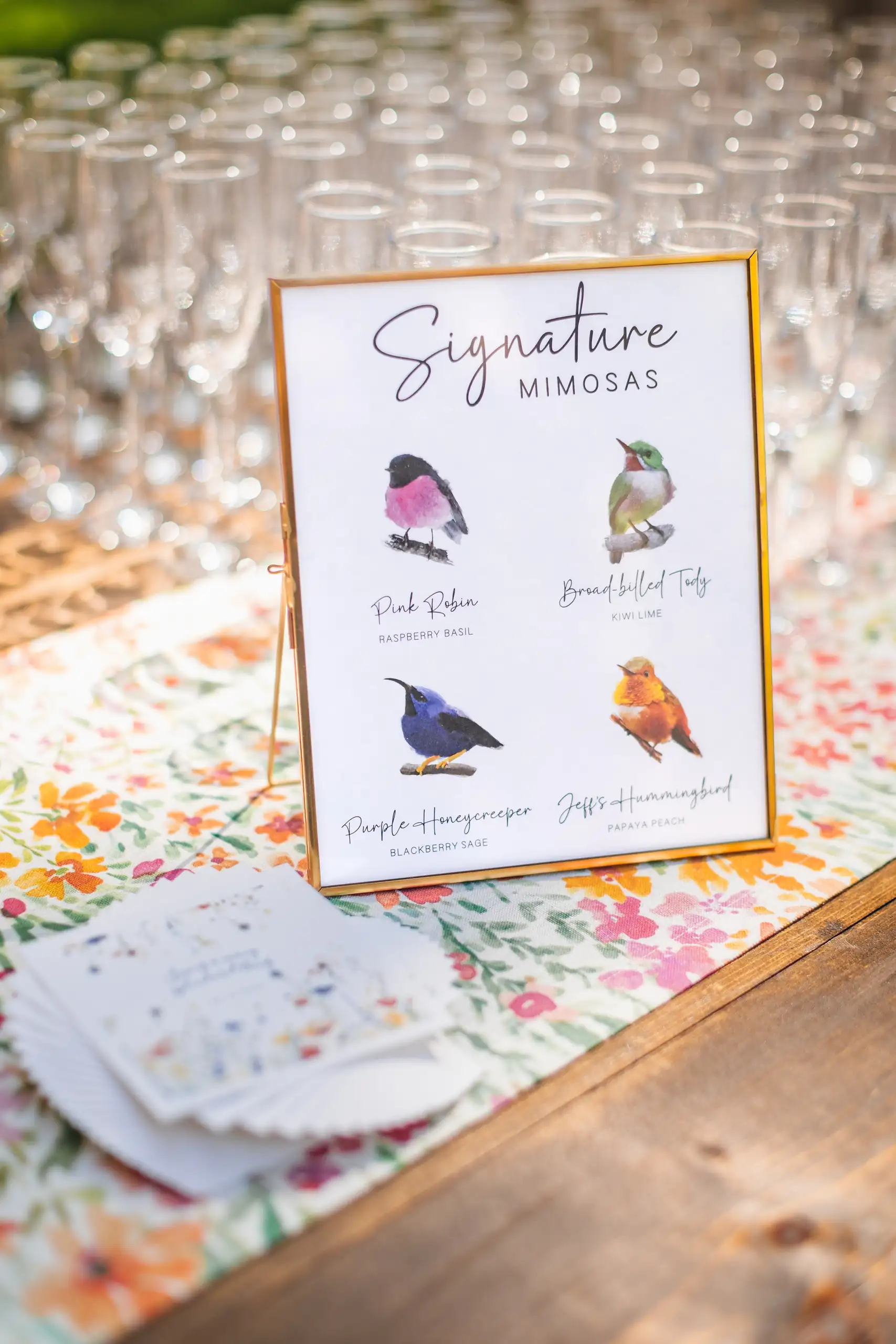 Reception Details: a signature mimosas sign painted with birds, at their wedding at Callanwolde Fine Arts Center in Atlanta, GA
