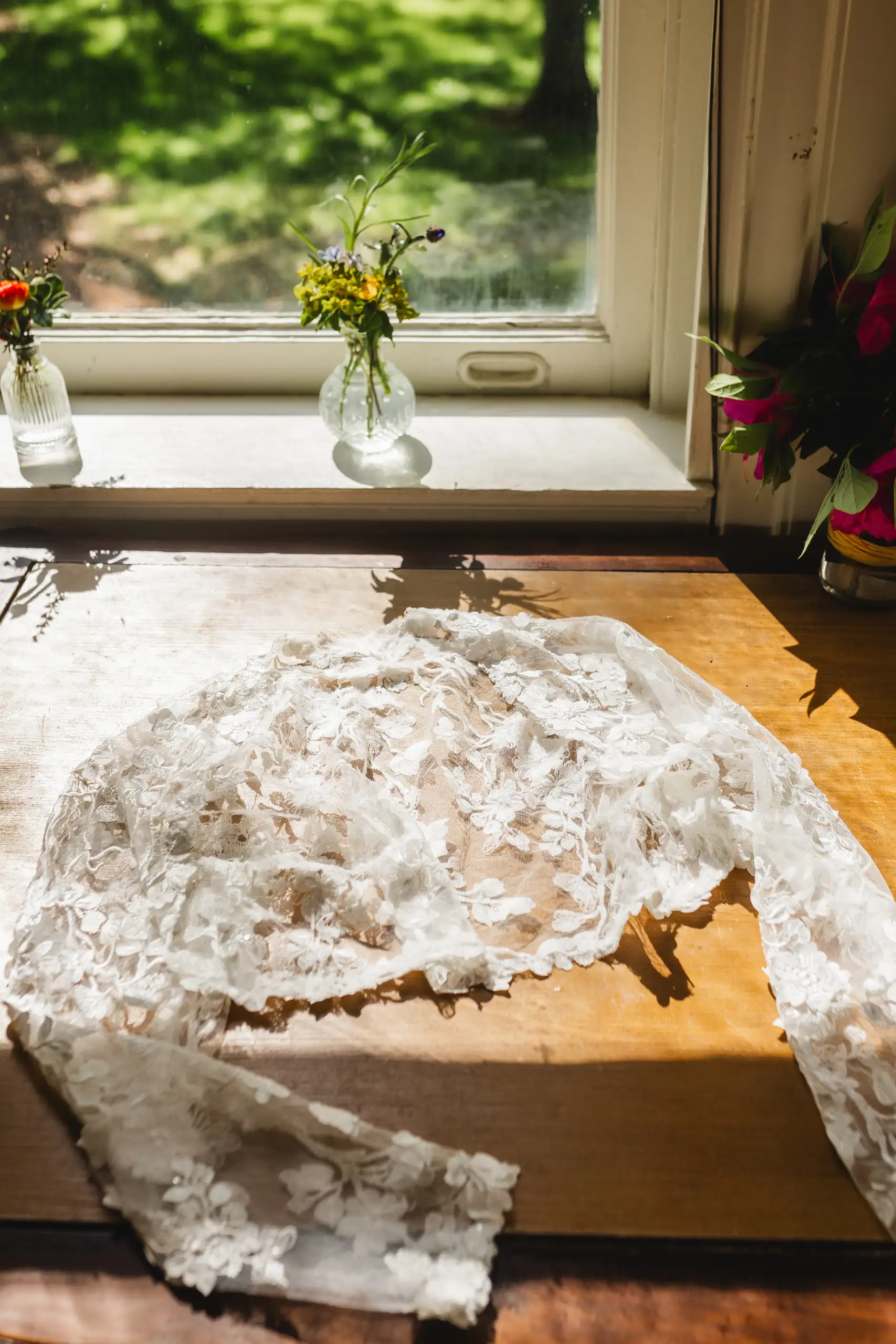 Wedding Details: the lace veil laid out in the window light, at a wedding at Callanwolde Fine Arts Center in Atlanta, GA