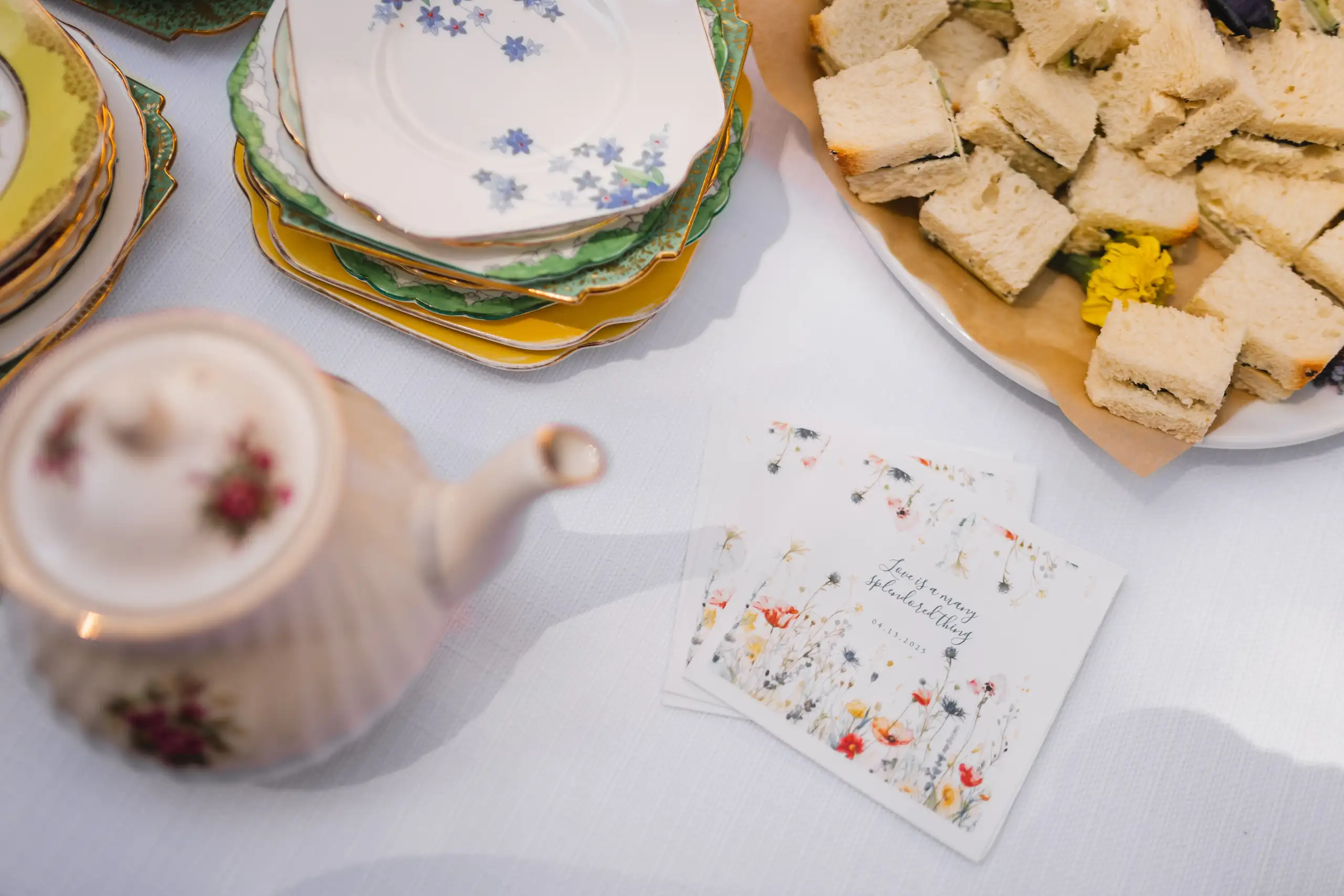 Reception Details: a teapot and finger sandwiches with a menu card, at their wedding at Callanwolde Fine Arts Center in Atlanta, GA