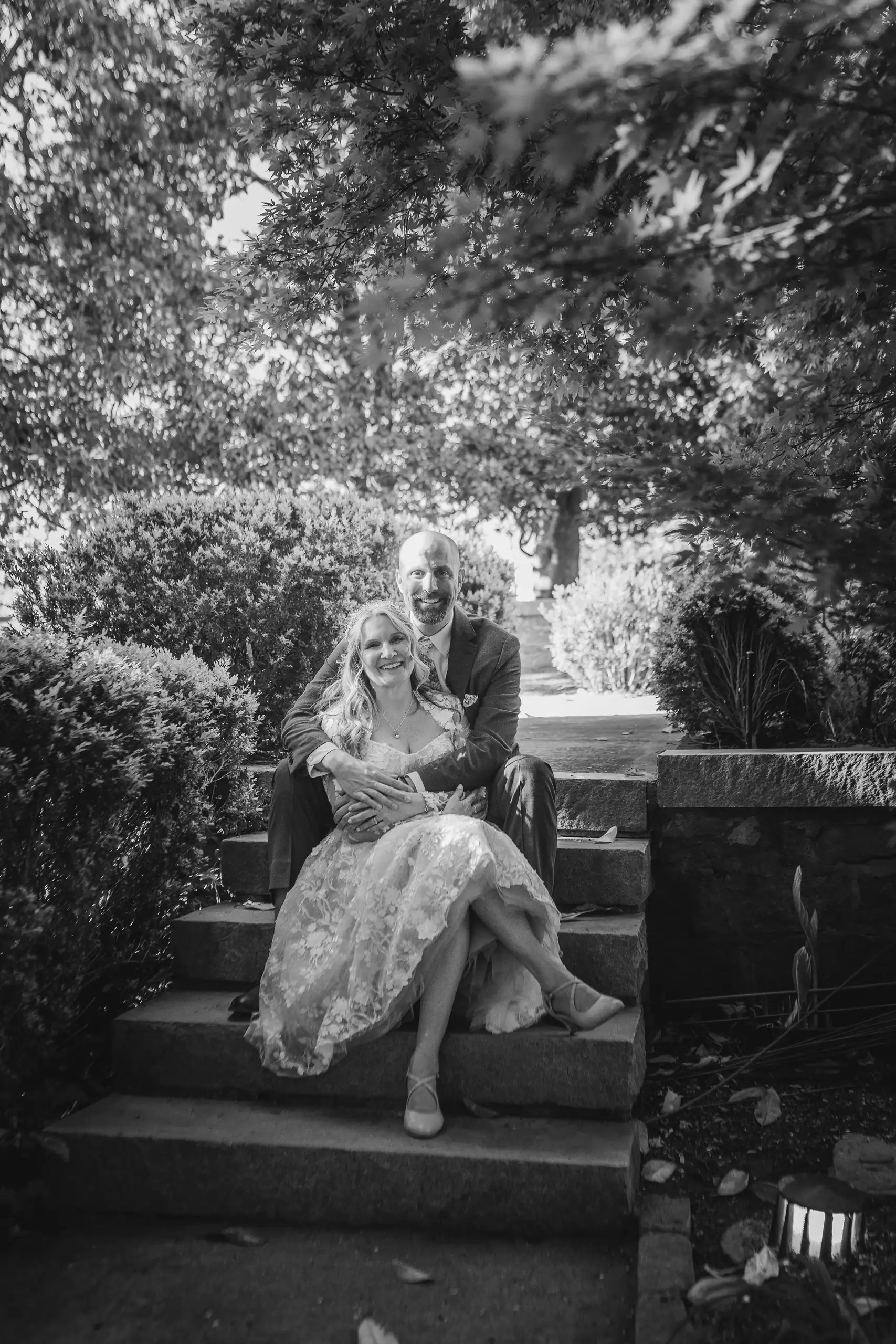 Wedding Formals: the couple on the stone steps, in black and white, at their wedding at Callanwolde Fine Arts Center in Atlanta, GA