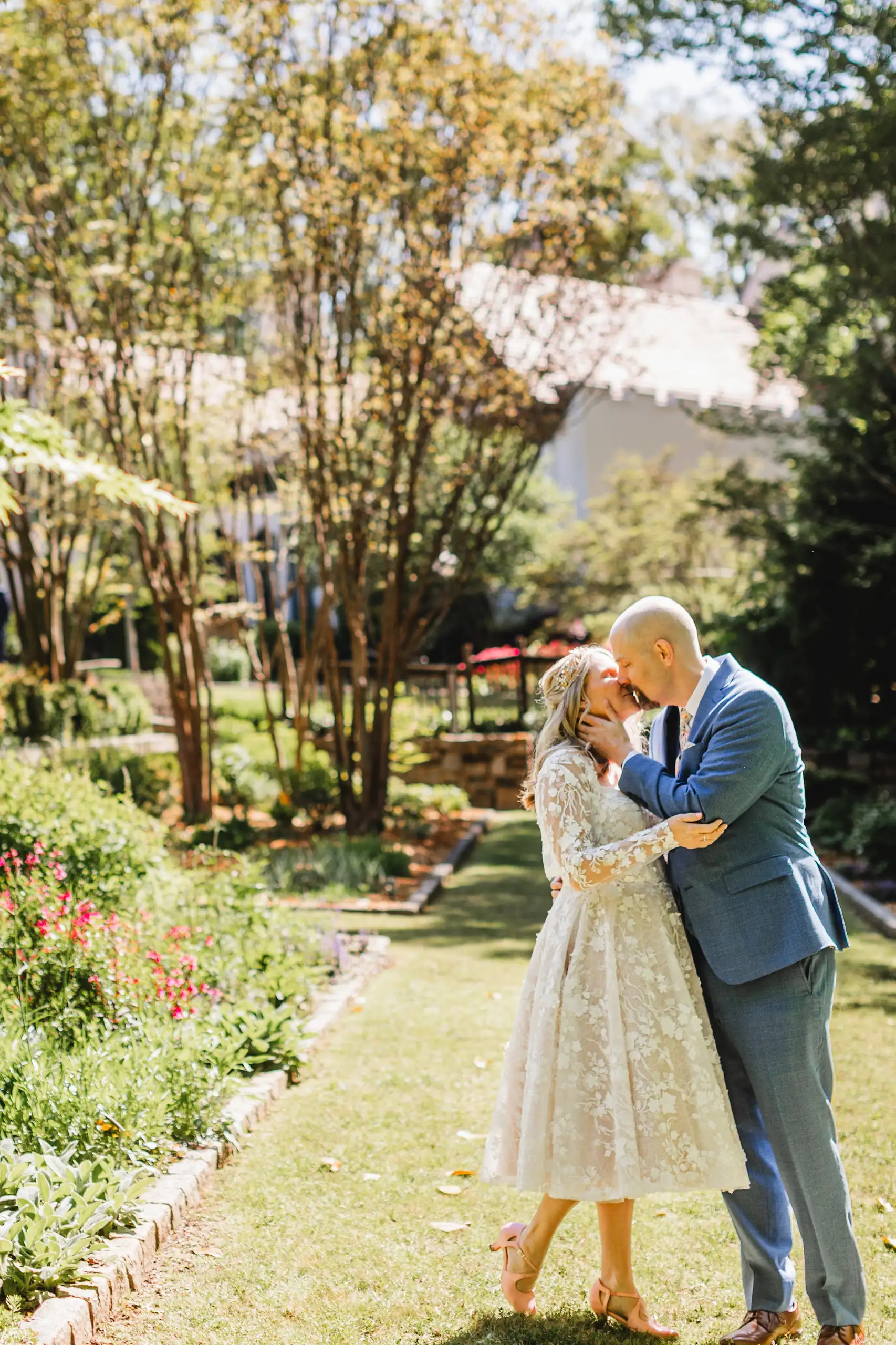 Wedding Formals: the couple kissing out on the lawn, at their wedding at Callanwolde Fine Arts Center in Atlanta, GA