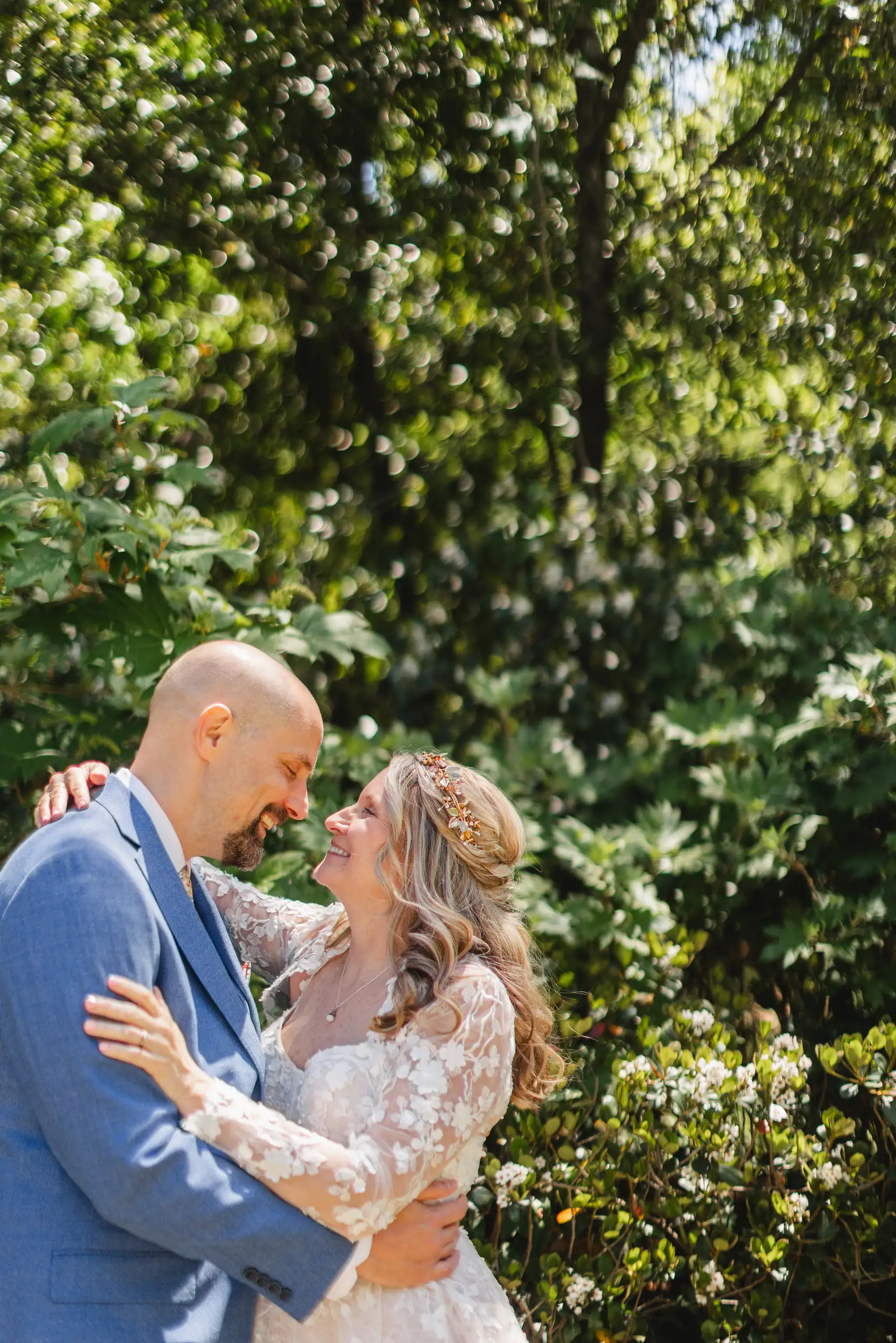 Wedding Formals: the couple embracing in the garden, at their wedding at Callanwolde Fine Arts Center in Atlanta, GA