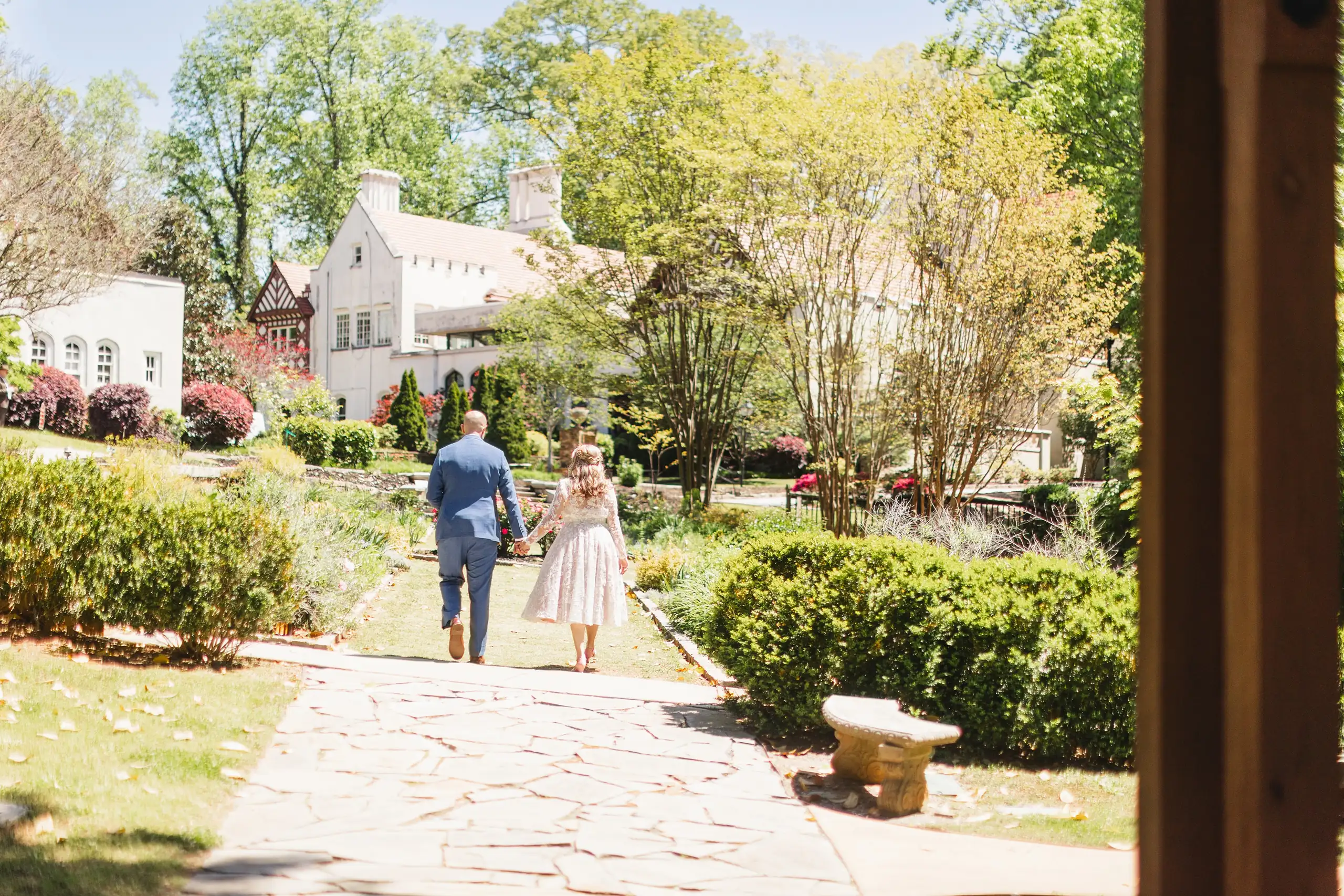 Wedding Formals: the couple walking the path to the mansion, at their wedding at Callanwolde Fine Arts Center in Atlanta, GA