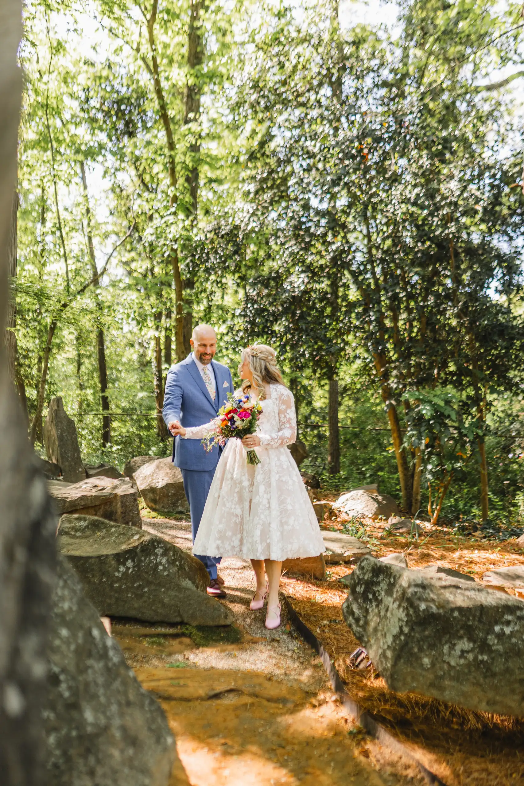 Wedding Formals: the couple out on the rocks in the woodland, at their wedding at Callanwolde Fine Arts Center in Atlanta, GA
