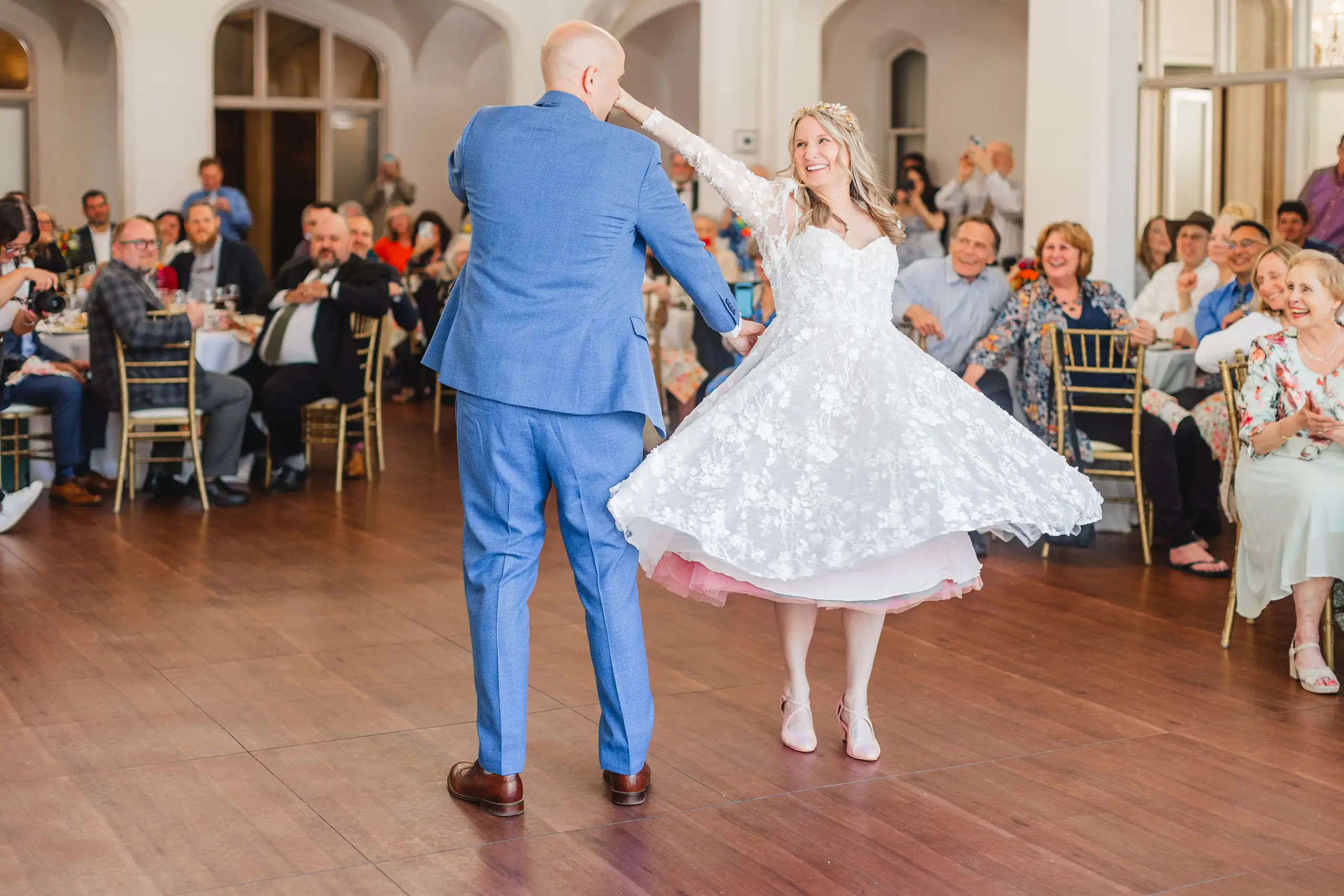 First Dance: the groom twirling the bride, her petticoat out, at their wedding at Callanwolde Fine Arts Center in Atlanta, GA