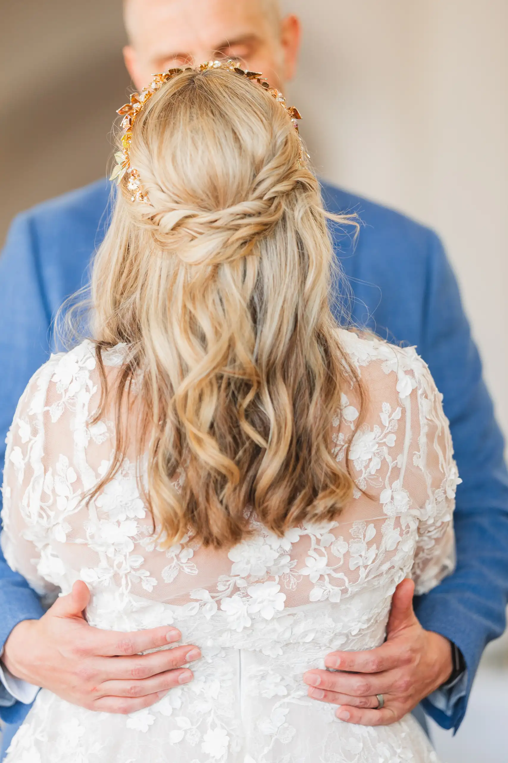 Wedding Formals: the bride from behind, his hands at her waist, at their wedding at Callanwolde Fine Arts Center in Atlanta, GA