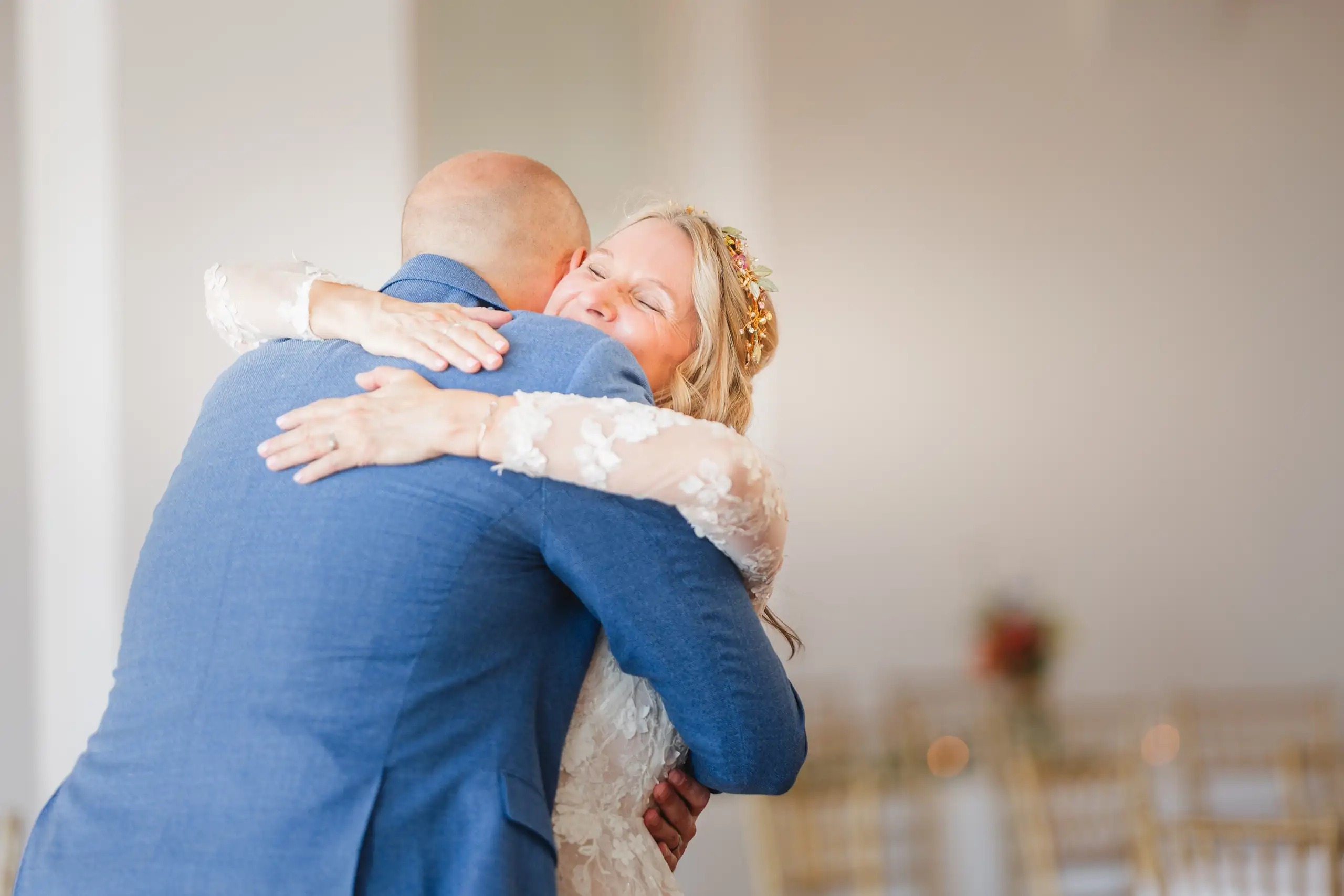 Wedding Formals: the couple holding each other tightly, at their wedding at Callanwolde Fine Arts Center in Atlanta, GA