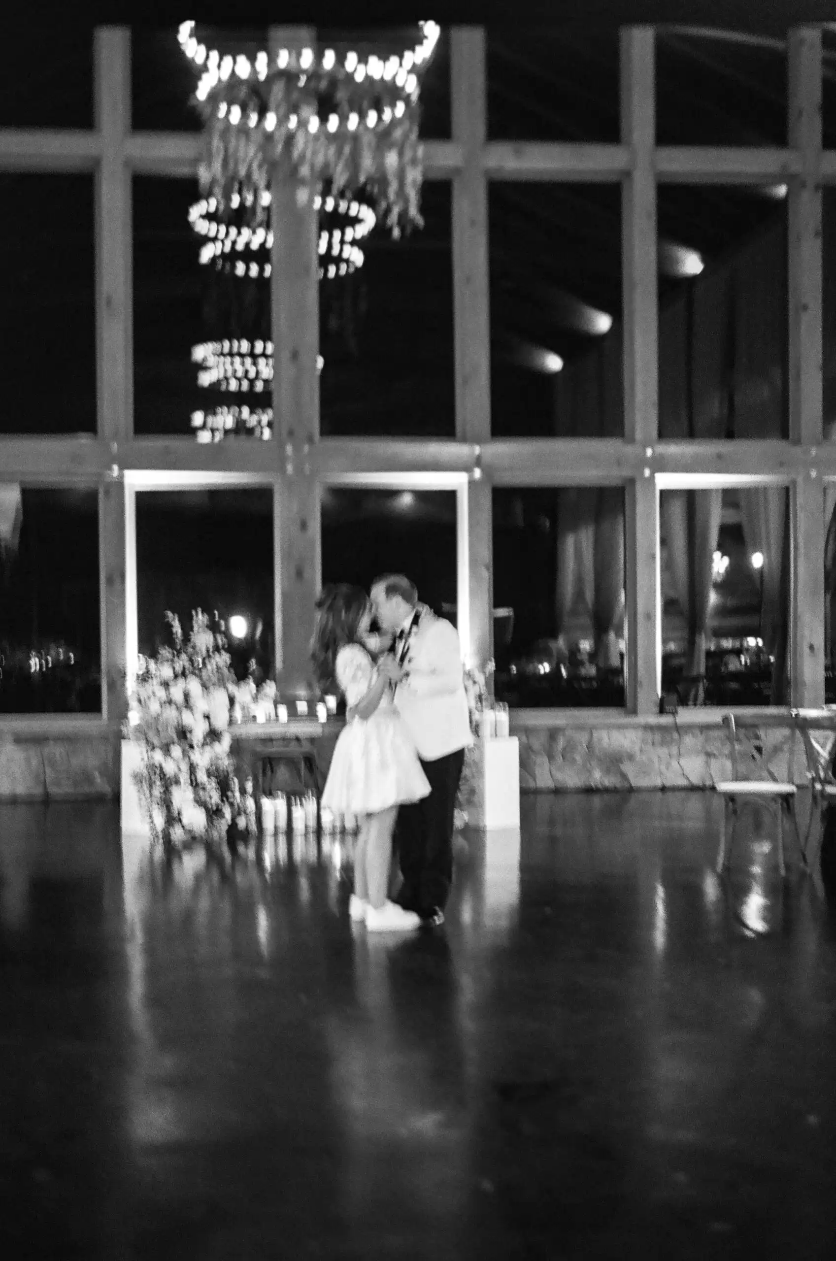 Bride and groom's first dance at their wedding reception, in black and white on 35mm film