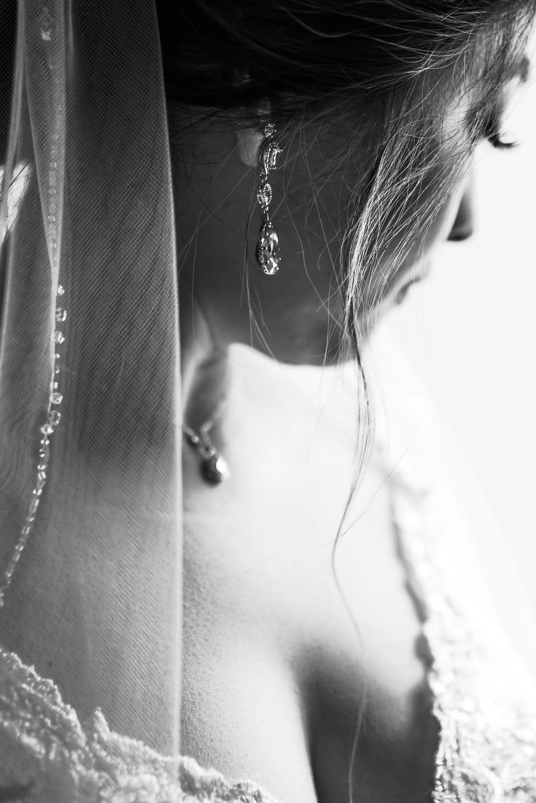 Getting Ready: the bride in her veil, in black and white before their wedding at Holy Cross Catholic Church in Atlanta, GA