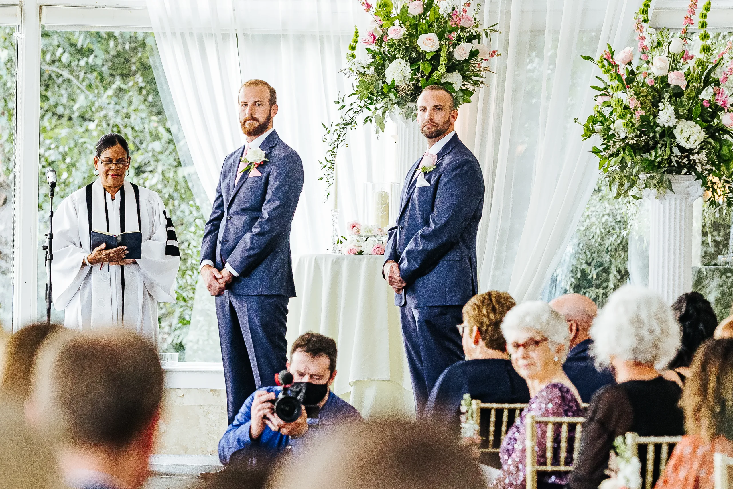Wedding Ceremony: the groom and his best man waiting with the officiant, at their wedding at The Piedmont Room in Atlanta, GA