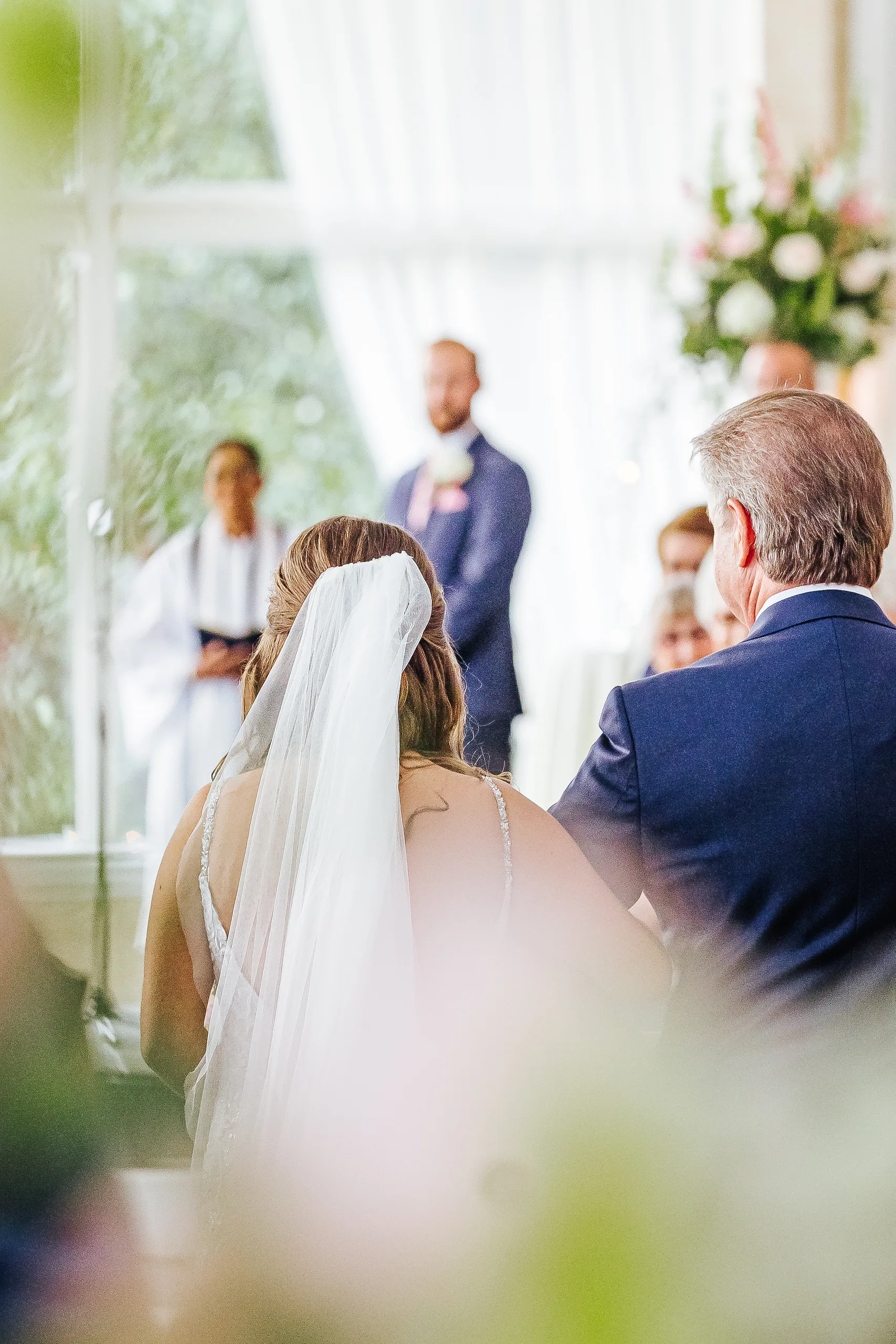 Wedding Ceremony: the bride and her dad walking toward the groom, at their wedding at The Piedmont Room in Atlanta, GA