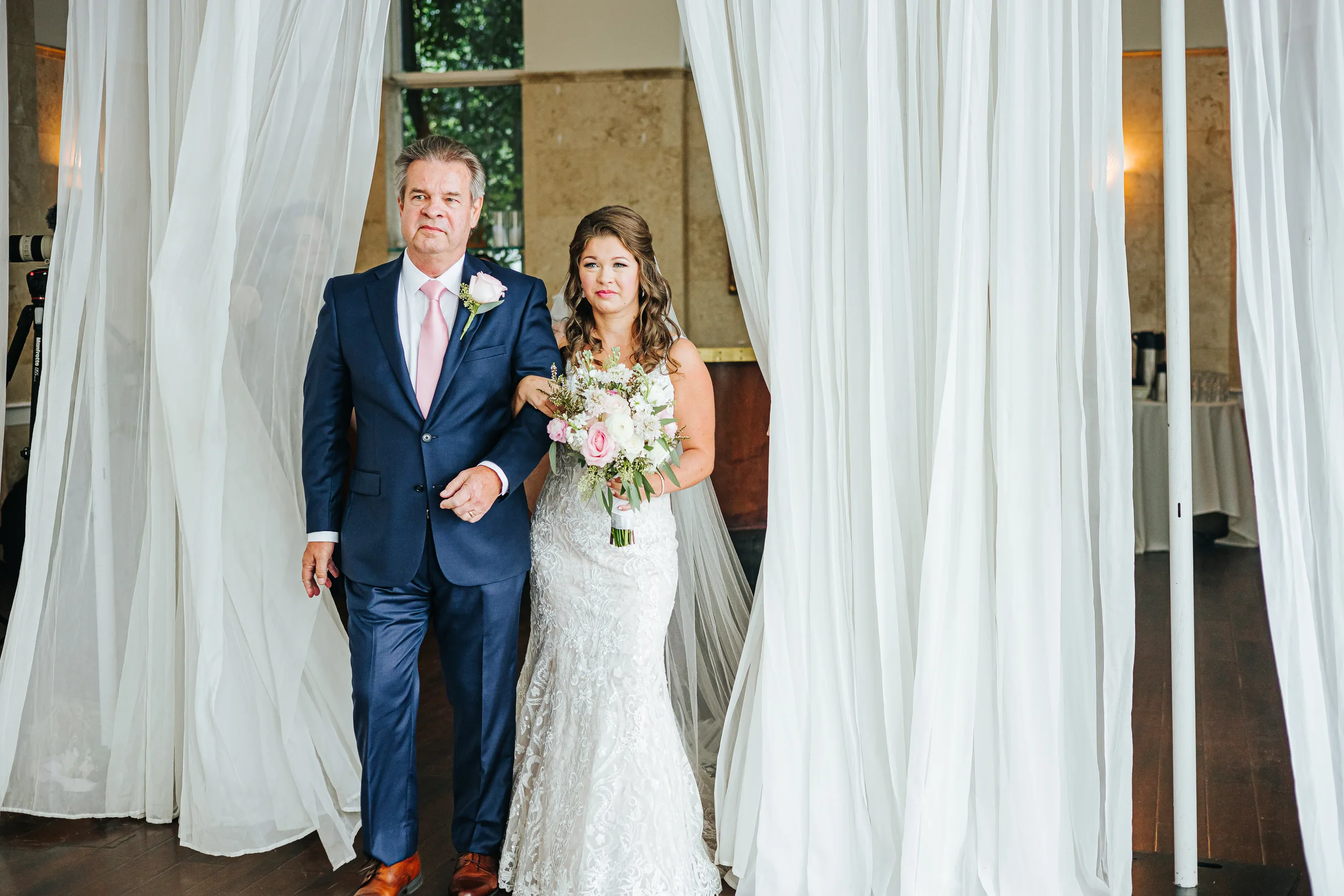 Wedding Ceremony: the bride and her dad stepping through the curtains, at their wedding at The Piedmont Room in Atlanta, GA
