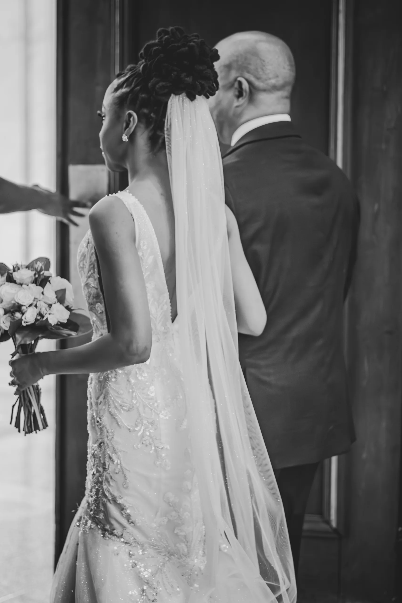 Wedding Ceremony: the bride walking down the aisle on the marble floor, at their wedding at the Historic DeKalb Courthouse in Decatur, GA