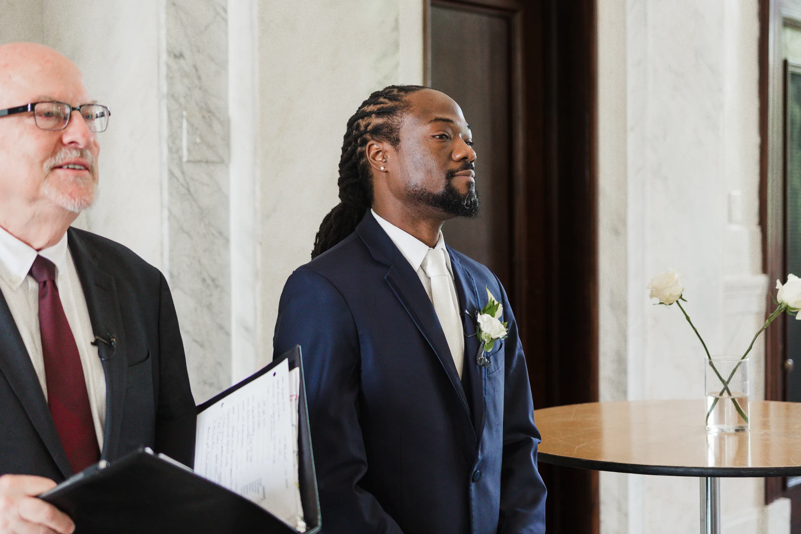 Wedding Ceremony: the groom watching her walk in, at their wedding at the Historic DeKalb Courthouse in Decatur, GA