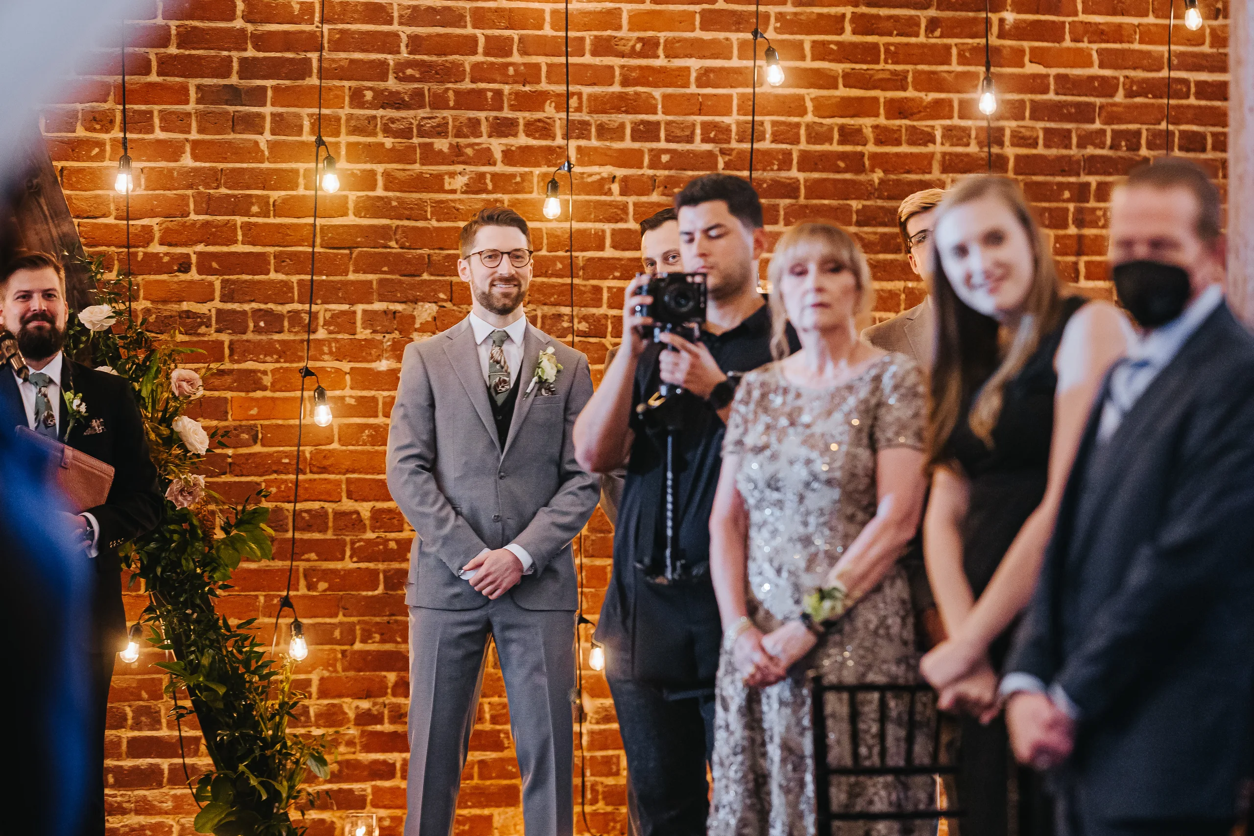 Wedding Ceremony: the groom watching her walk in, at their wedding at Terminus 330 in Atlanta, GA