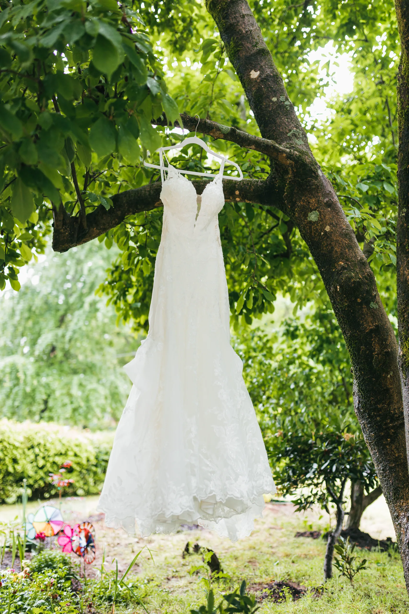 Wedding Details: her lace gown hanging from a tree at a wedding at the Payne-Corley House in Duluth, GA