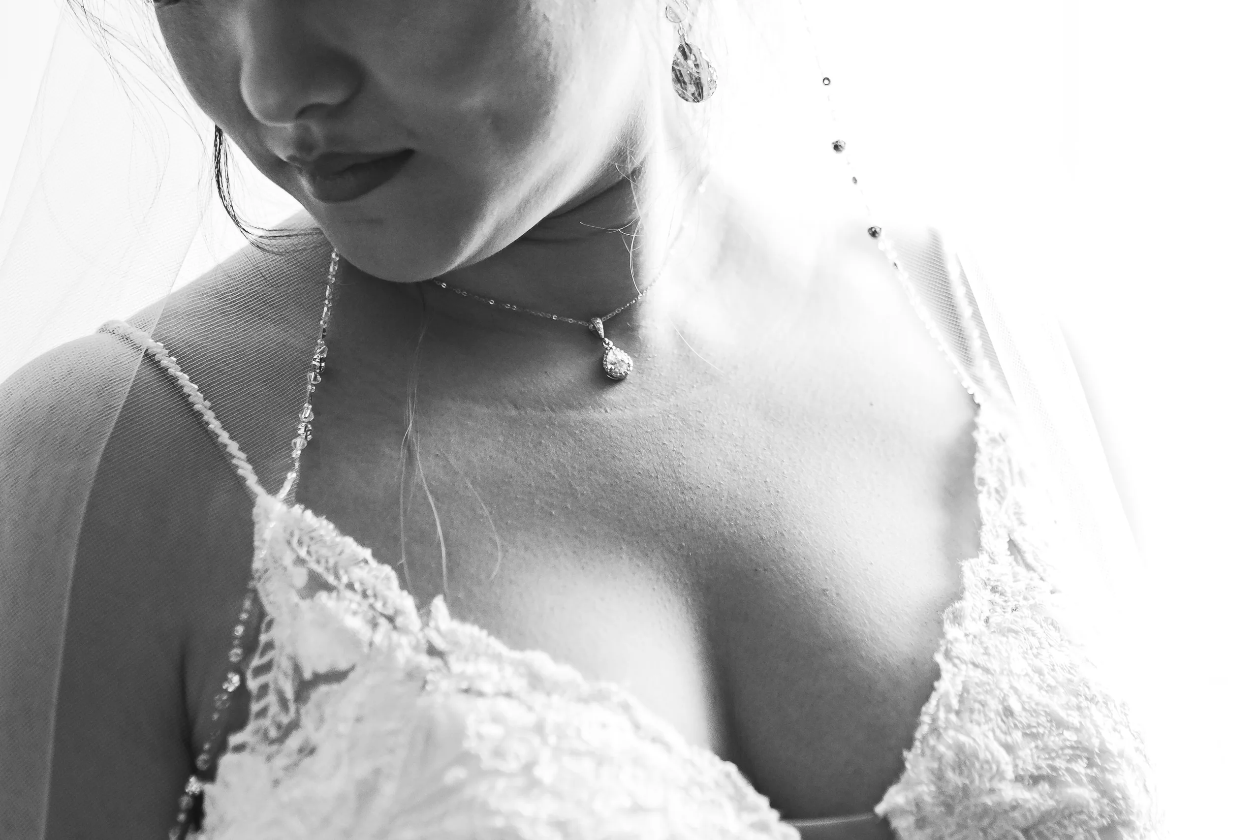 Bridal Portraits: the neckline of her gown, in black and white before their wedding at Holy Cross Catholic Church in Atlanta, GA