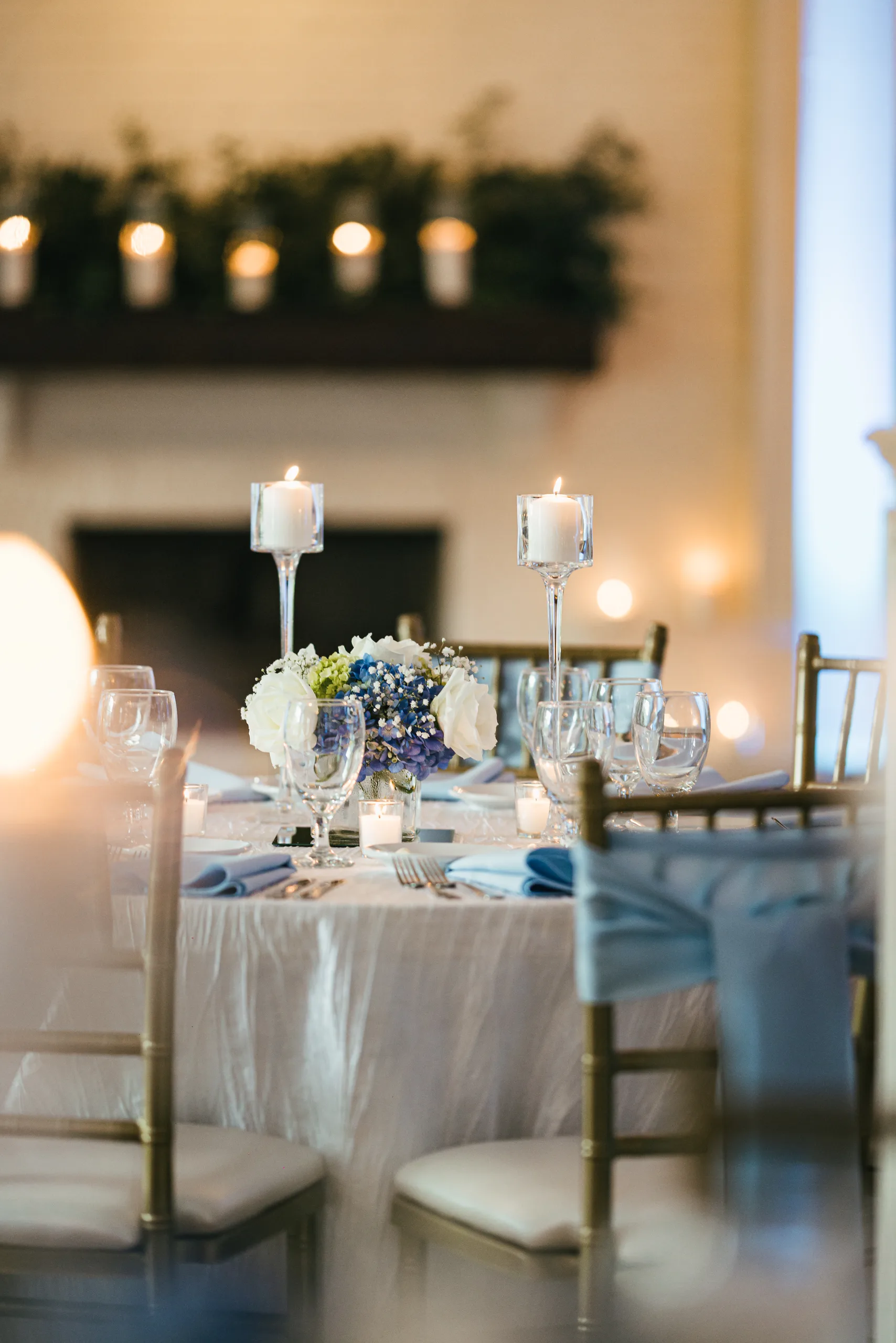 Reception Details: the reception tables by the fireplace at a wedding at the Payne-Corley House in Duluth, GA