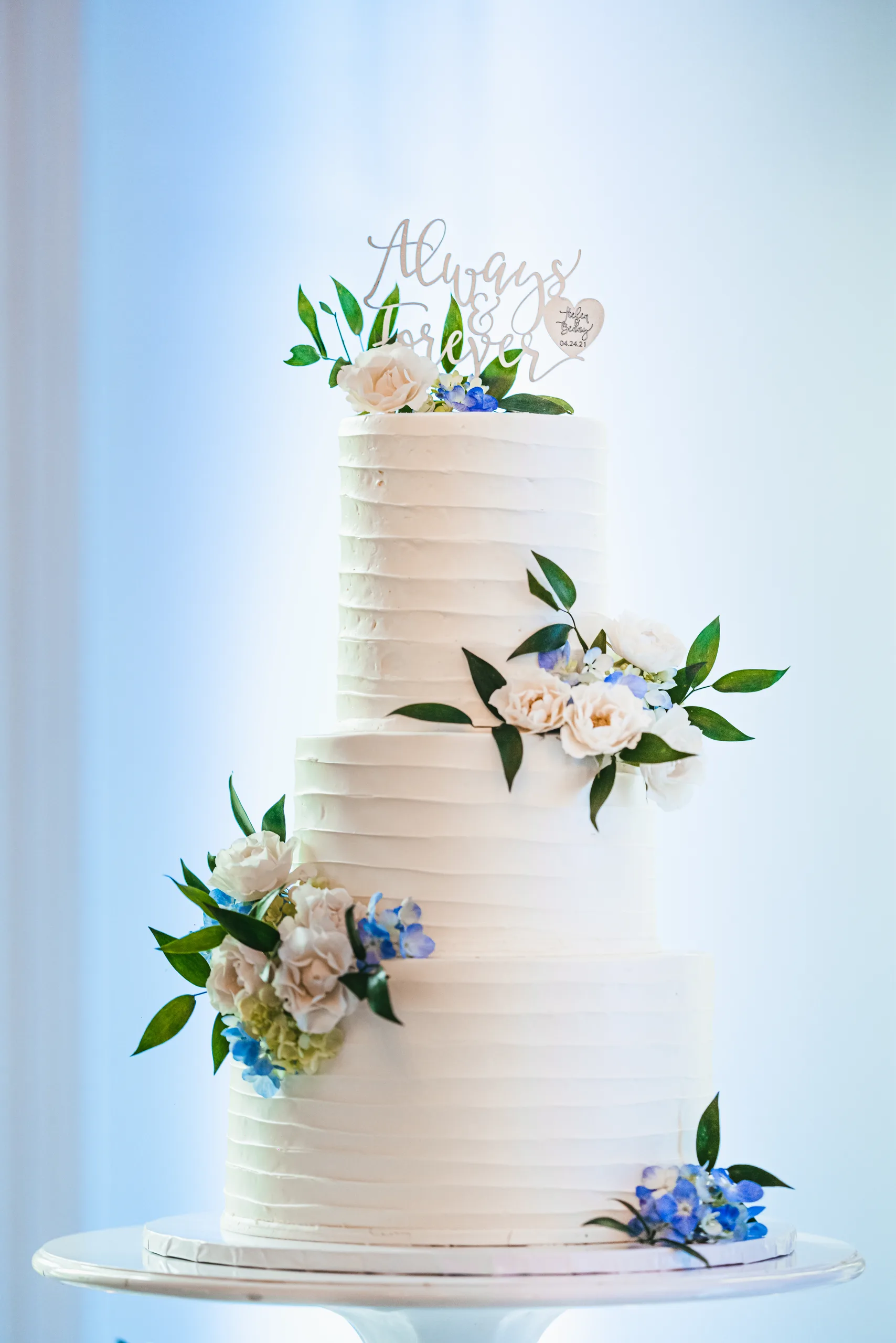 Wedding Cake Details: the wedding cake in the window light at a wedding at the Payne-Corley House in Duluth, GA