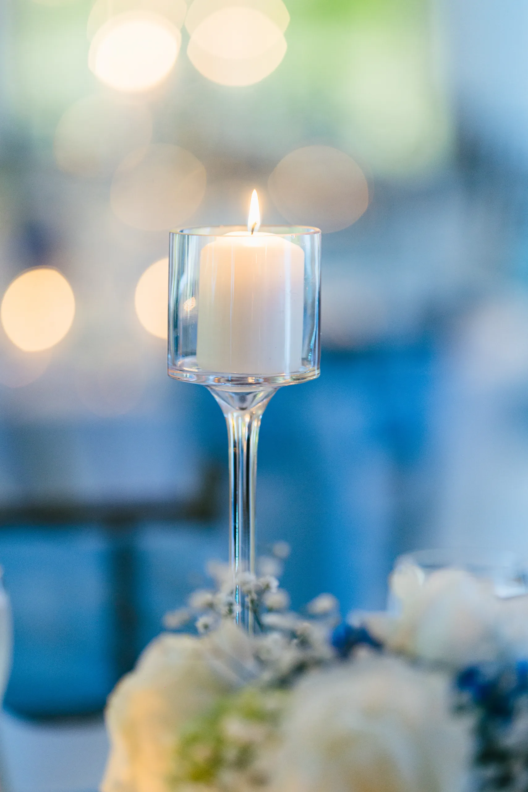 Reception Details: a floating candle over the centerpiece at a wedding at the Payne-Corley House in Duluth, GA