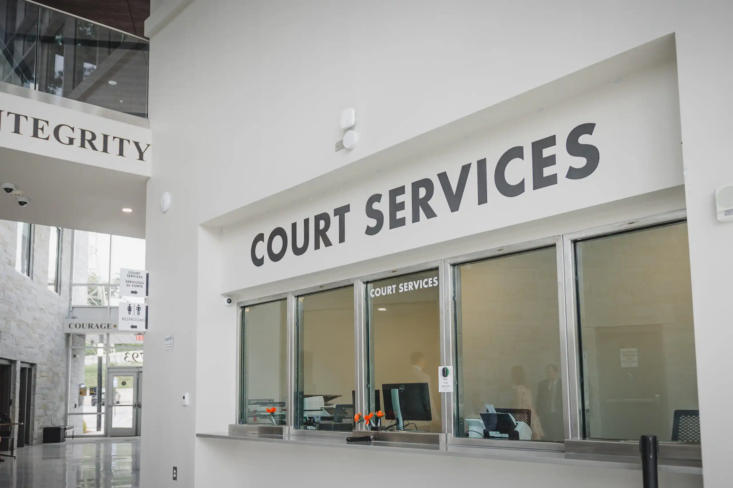 Wedding Details: the Court Services window in the lobby, before their courthouse wedding at Brookhaven City Hall in Brookhaven, GA