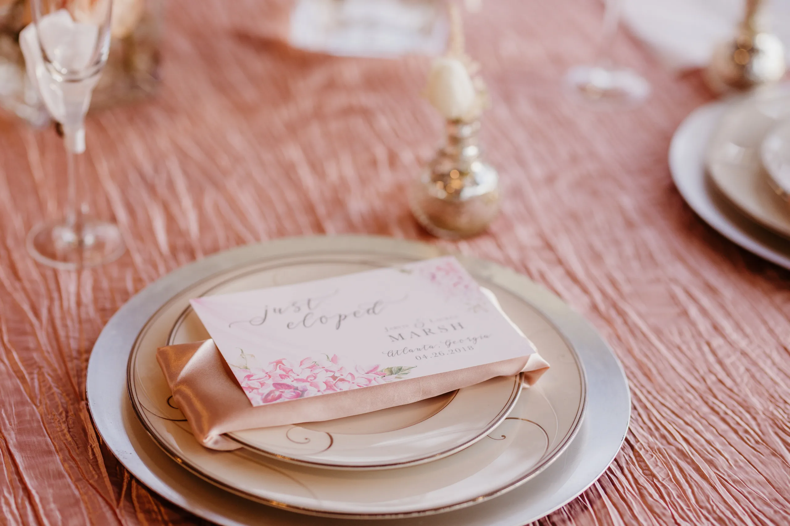 Wedding Details: a just eloped card on a place setting at the blush table, at an elopement at Ventanas in Atlanta, GA