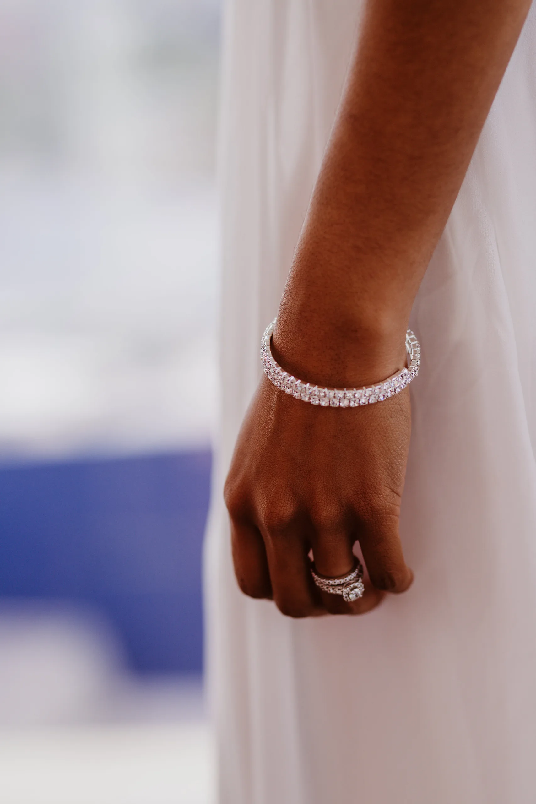 Wedding Details: her diamond bracelet and rings against her gown, at their elopement at Ventanas in Atlanta, GA