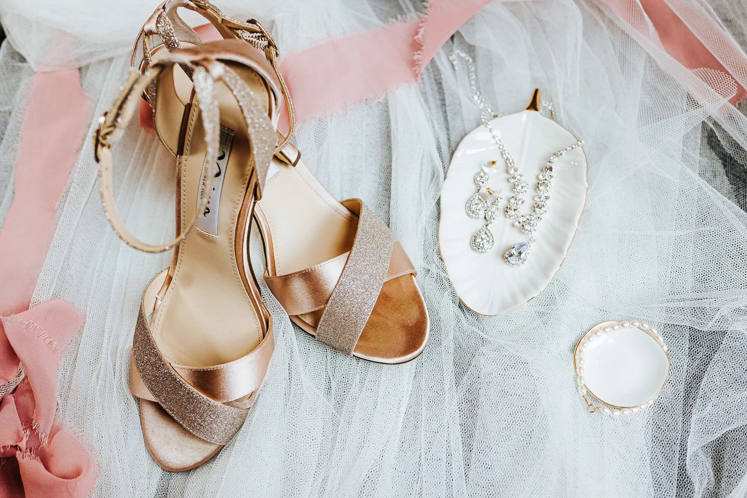 Wedding Details: her rose gold heels and earrings on pink silk ribbon, at a wedding at The Piedmont Room in Atlanta, GA