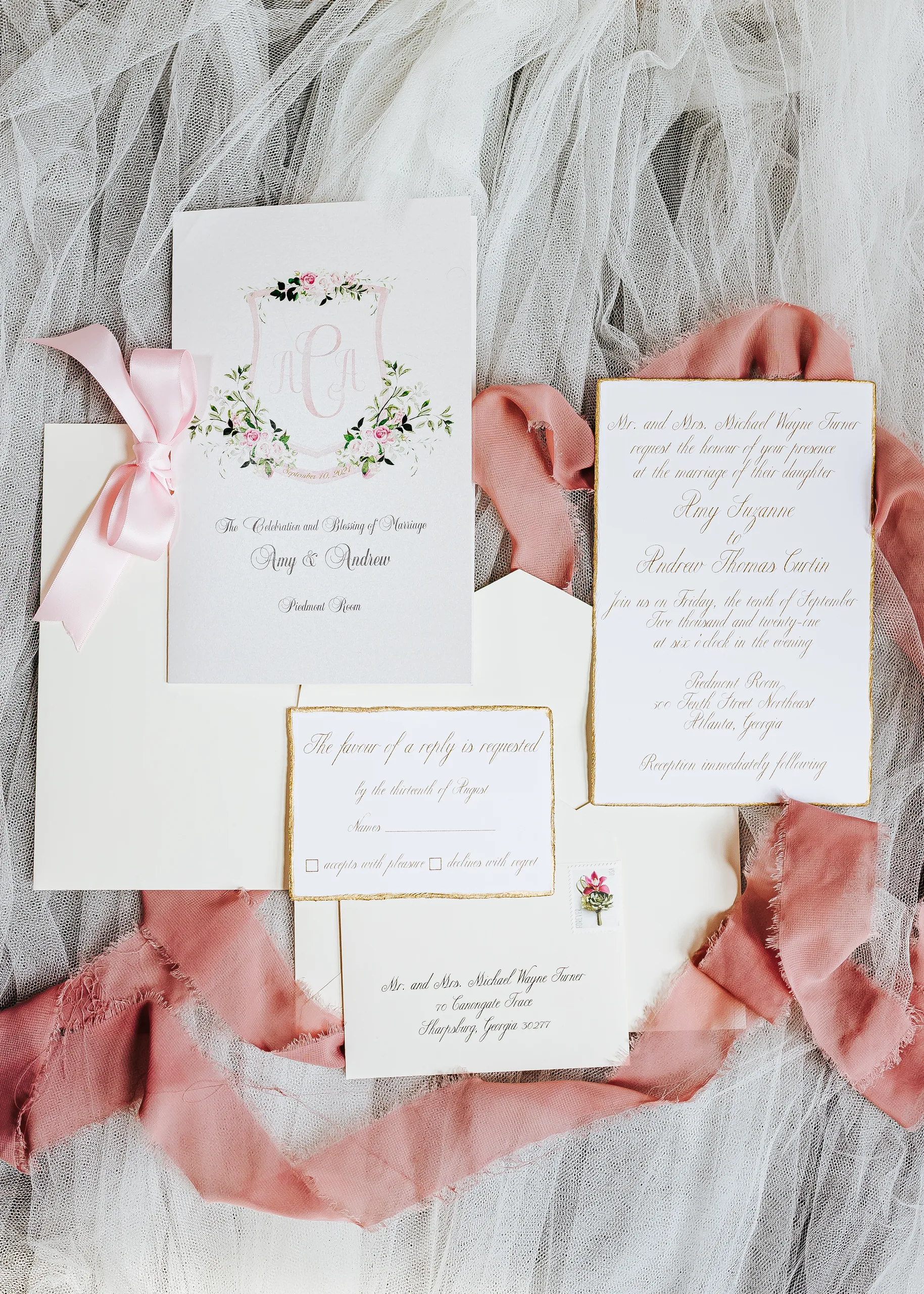 Wedding Details: the invitation suite with their monogram and pink silk ribbon, at a wedding at The Piedmont Room in Atlanta, GA