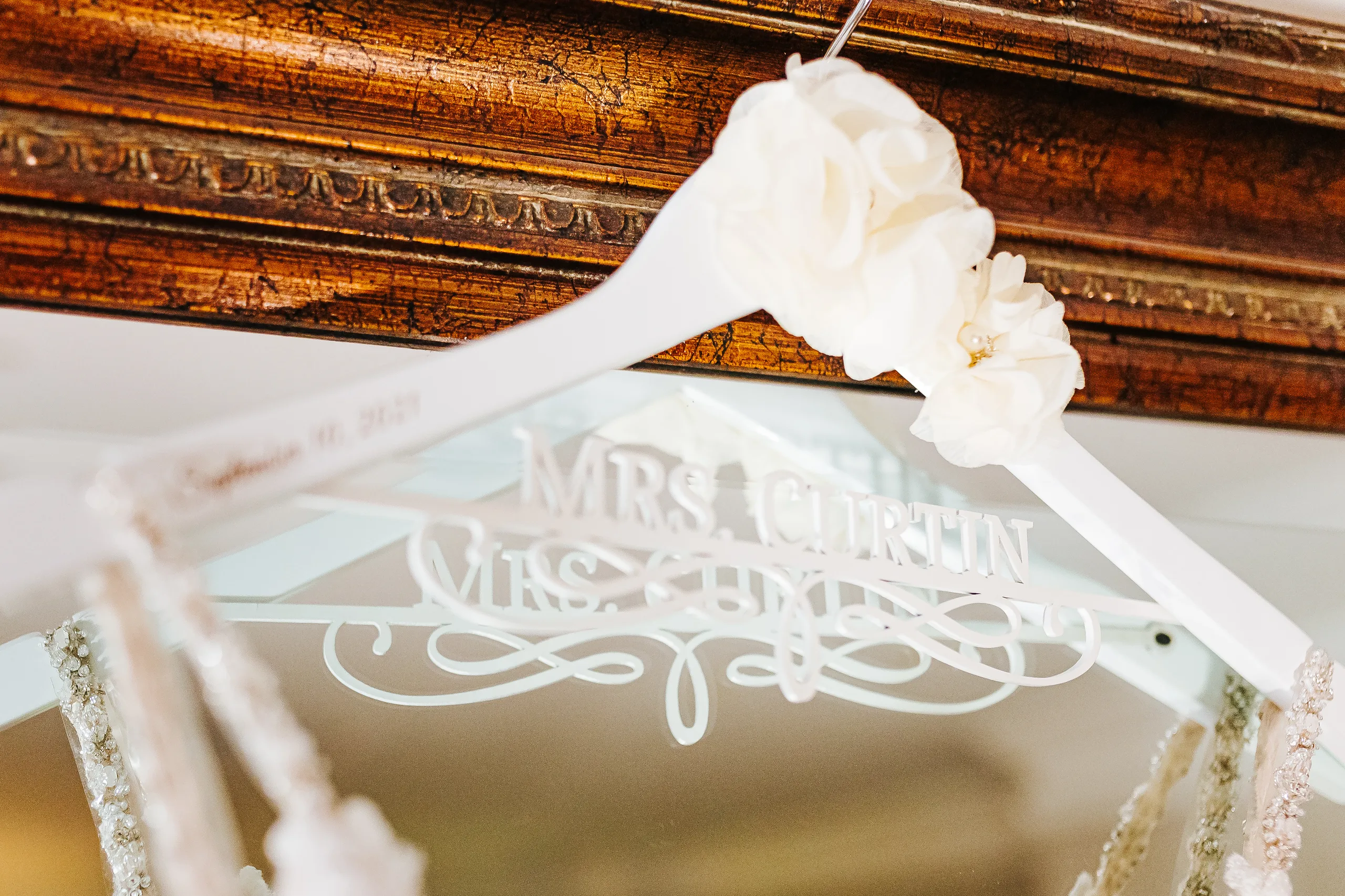 Wedding Details: her Mrs. Curtin hanger with the wedding date, at a wedding at The Piedmont Room in Atlanta, GA