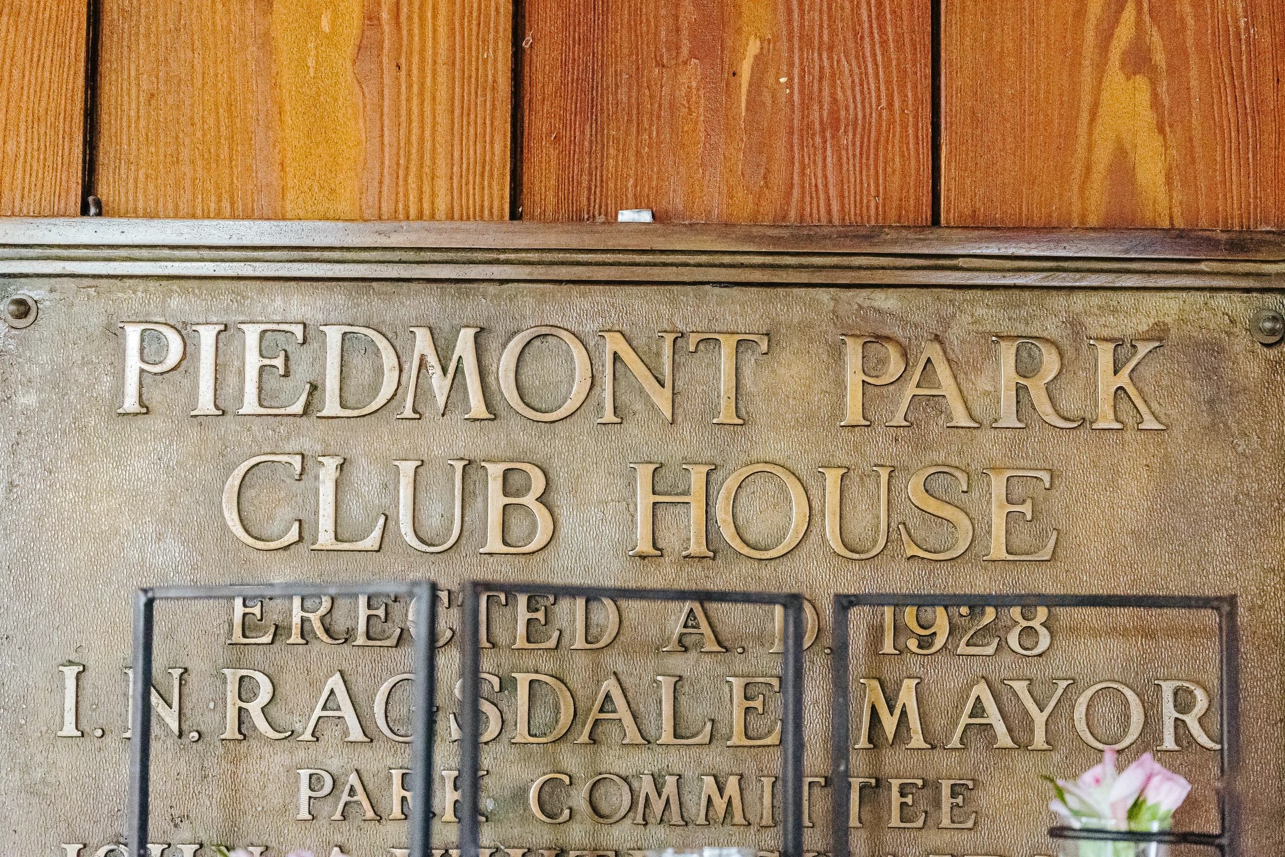 Wedding Details: the 1928 Piedmont Park Club House plaque, at a wedding at The Piedmont Room in Atlanta, GA