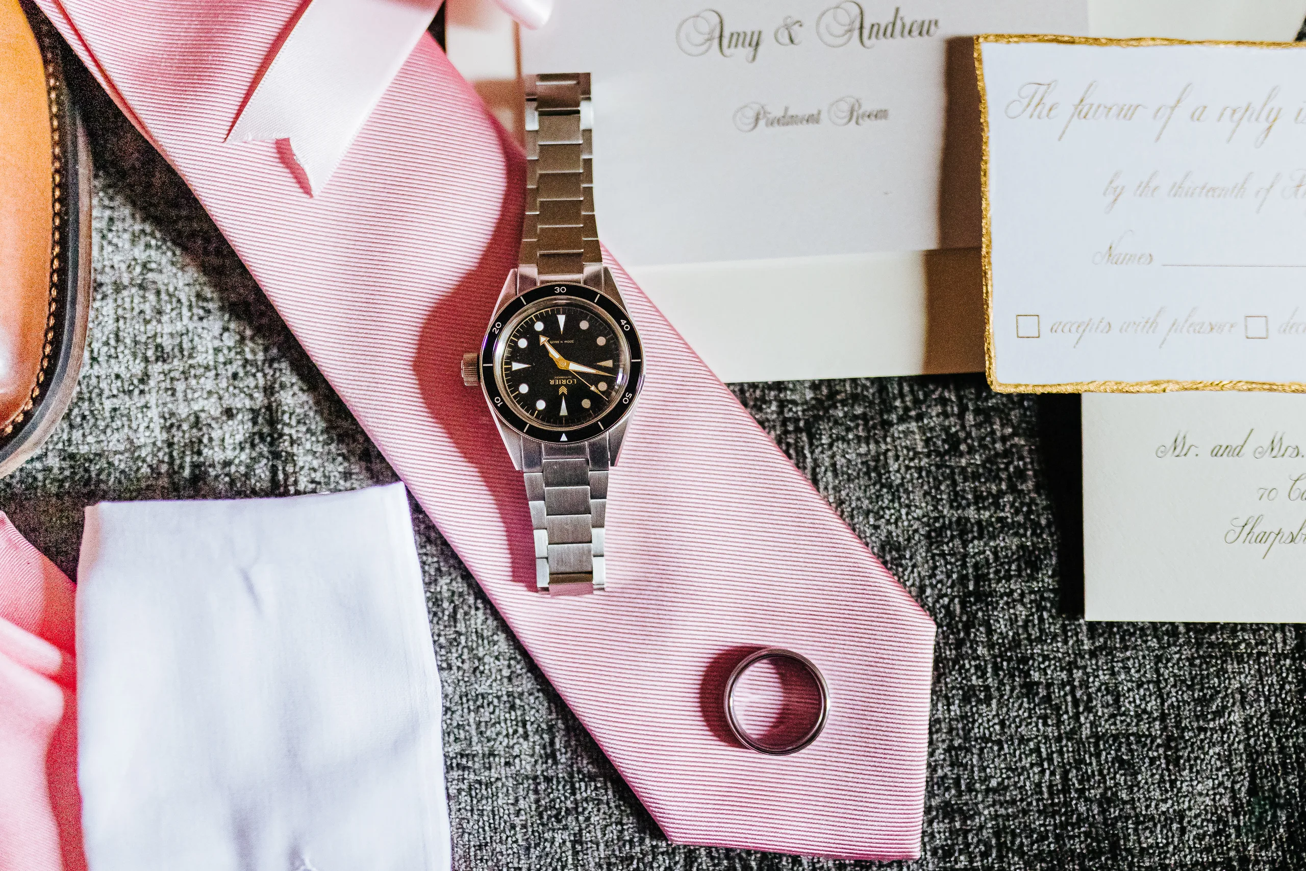 Wedding Details: his watch and wedding band on his pink tie, at a wedding at The Piedmont Room in Atlanta, GA