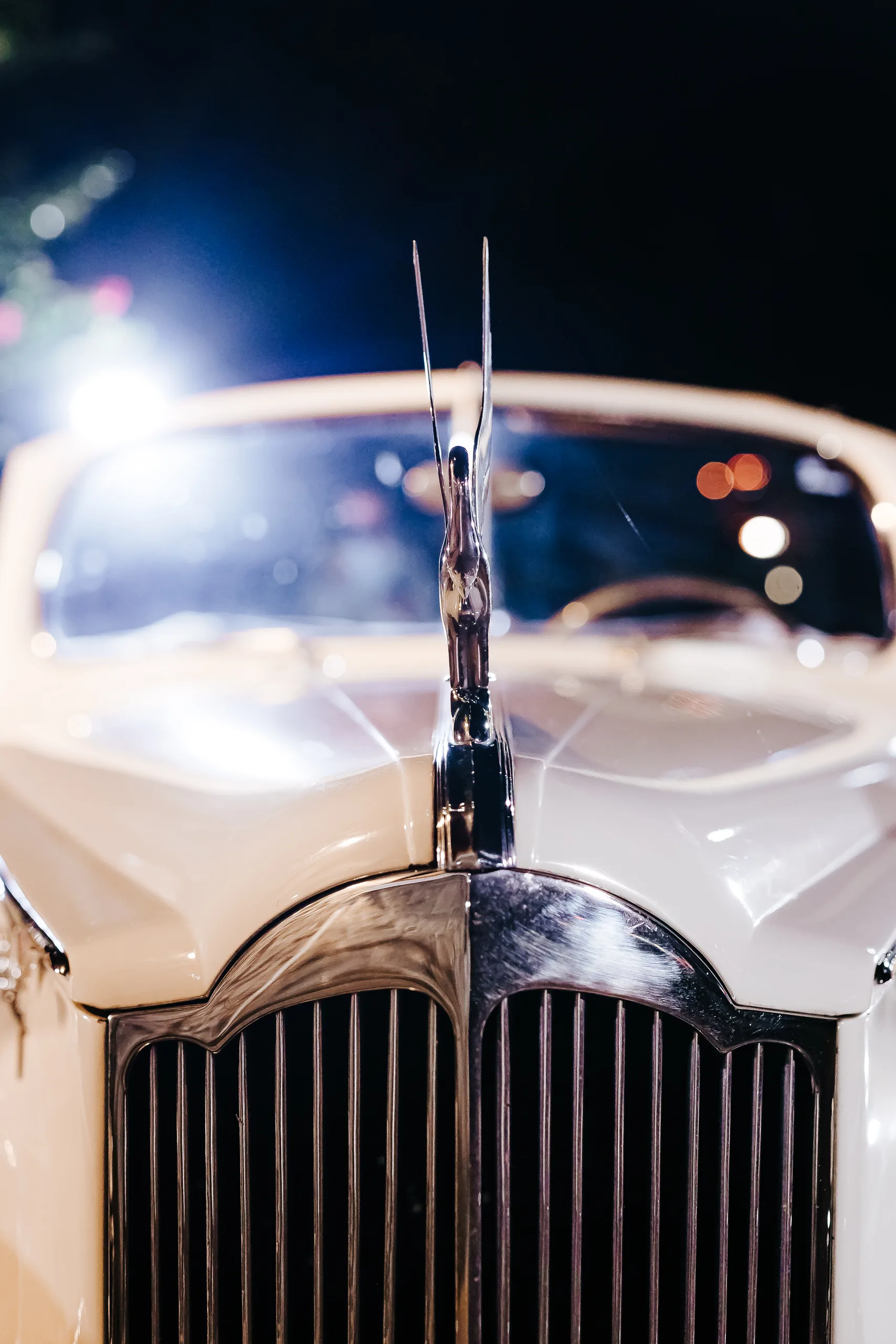 Send-Off: the hood ornament and grille of the vintage Packard convertible, at their wedding at The Piedmont Room in Atlanta, GA