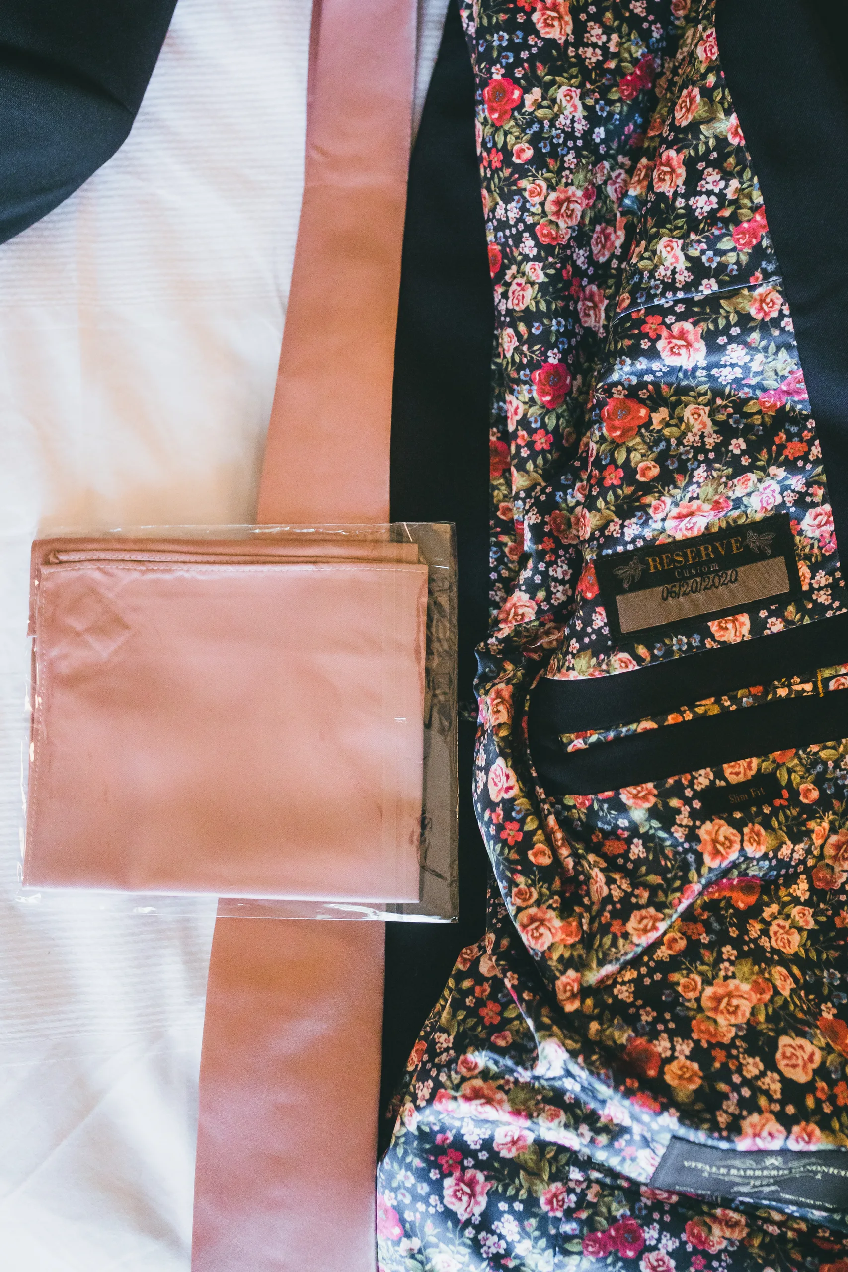 Wedding Details: his blush tie and pocket square on a jacket with a floral lining, at a wedding at Atlanta Evergreen Lakeside Resort in Stone Mountain, GA