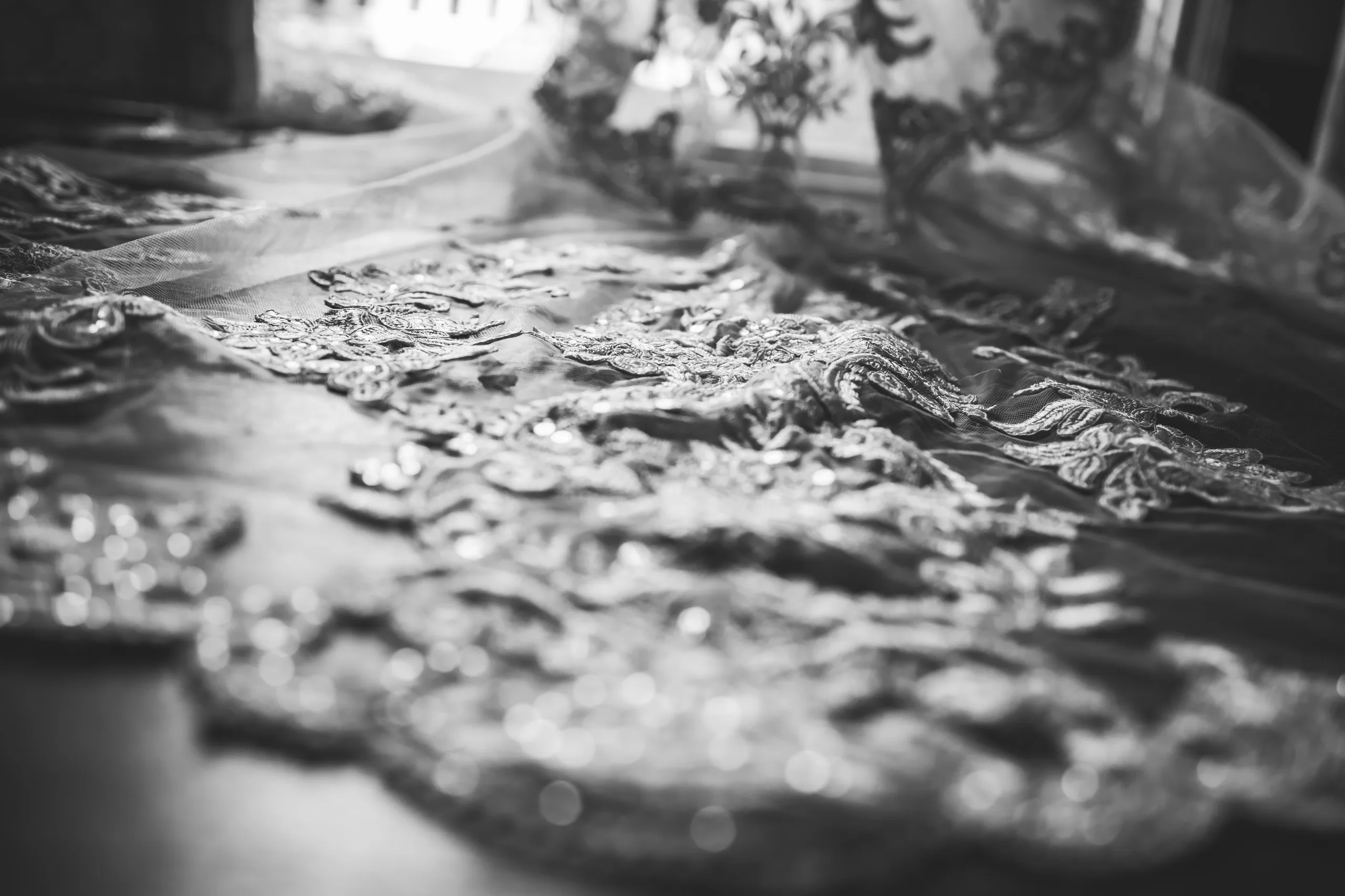 Wedding Details: the lace on her gown up close, in black and white, at a wedding at Atlanta Evergreen Lakeside Resort in Stone Mountain, GA