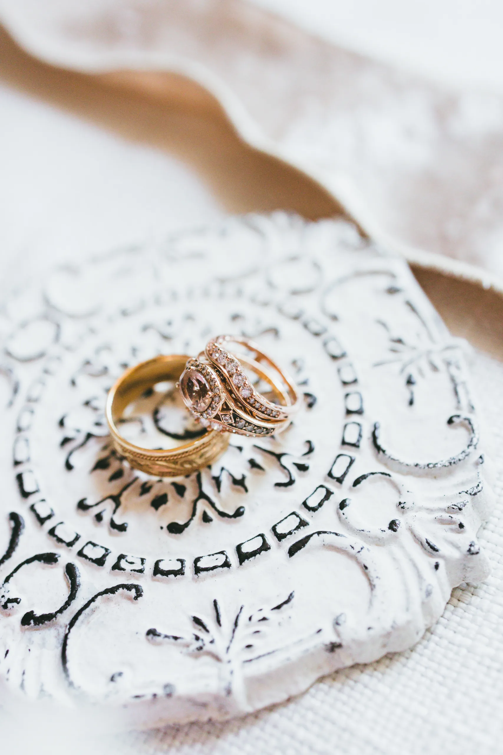 Wedding Details: their wedding rings on a white dish, at a wedding at Atlanta Evergreen Lakeside Resort in Stone Mountain, GA