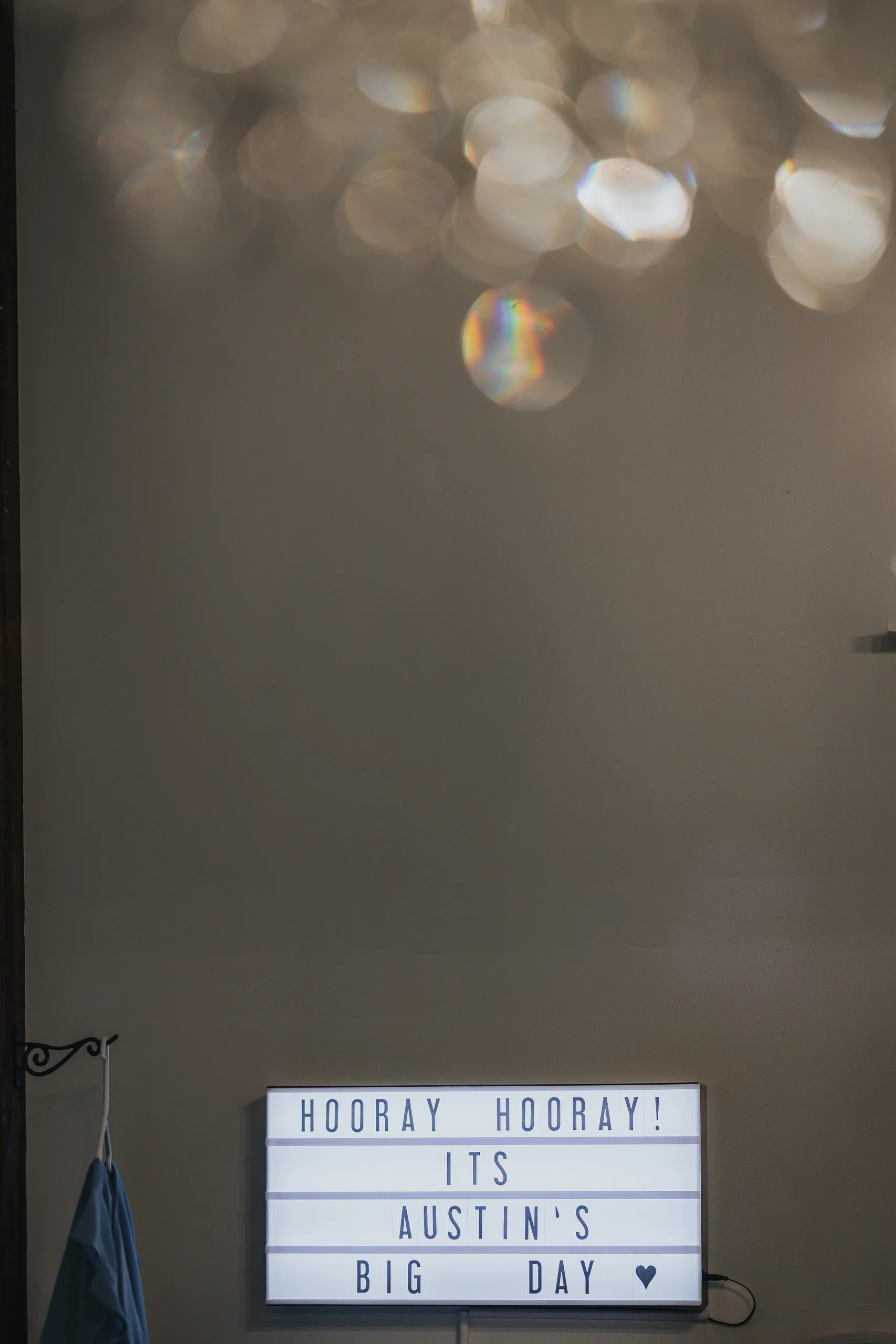 Wedding Details: a light box sign reading Hooray Hooray It's Austin's Big Day, at a wedding at The Wildflower 301 in Greensboro, GA