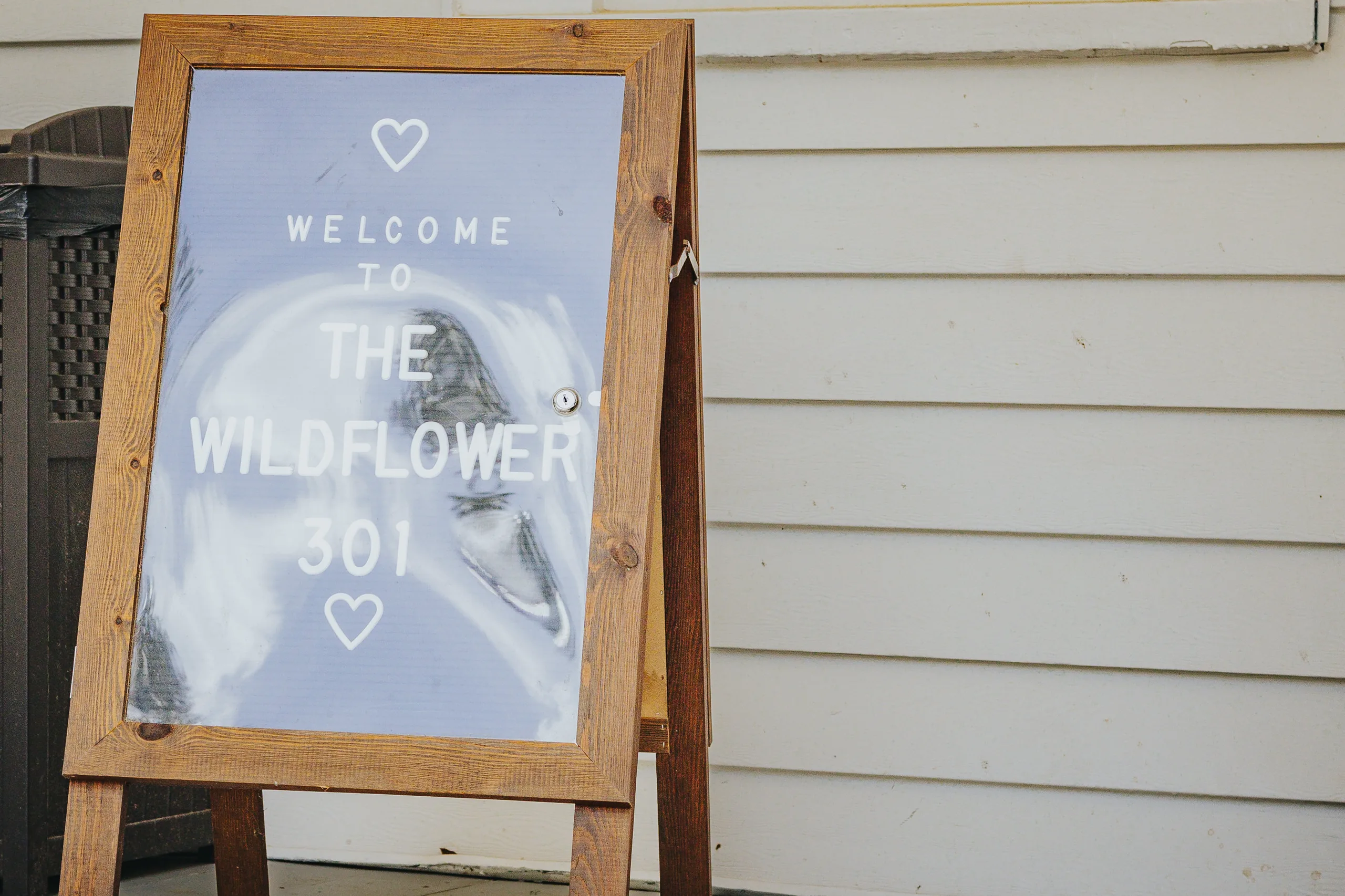 Wedding Details: the Welcome to The Wildflower 301 sign, at a wedding at The Wildflower 301 in Greensboro, GA