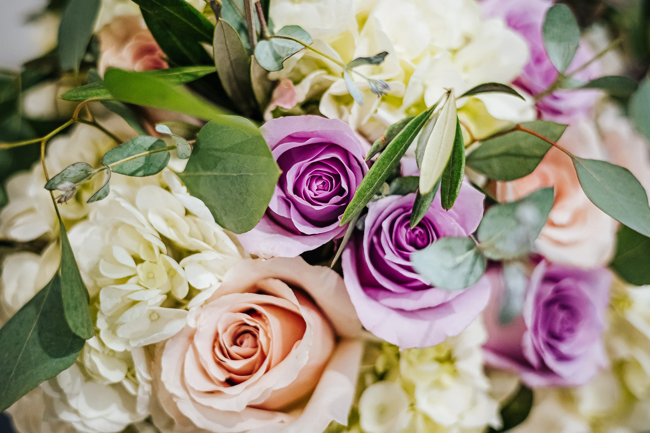 Wedding Florals: lavender and peach roses up close at a wedding at the Country Club of Roswell in Roswell, GA
