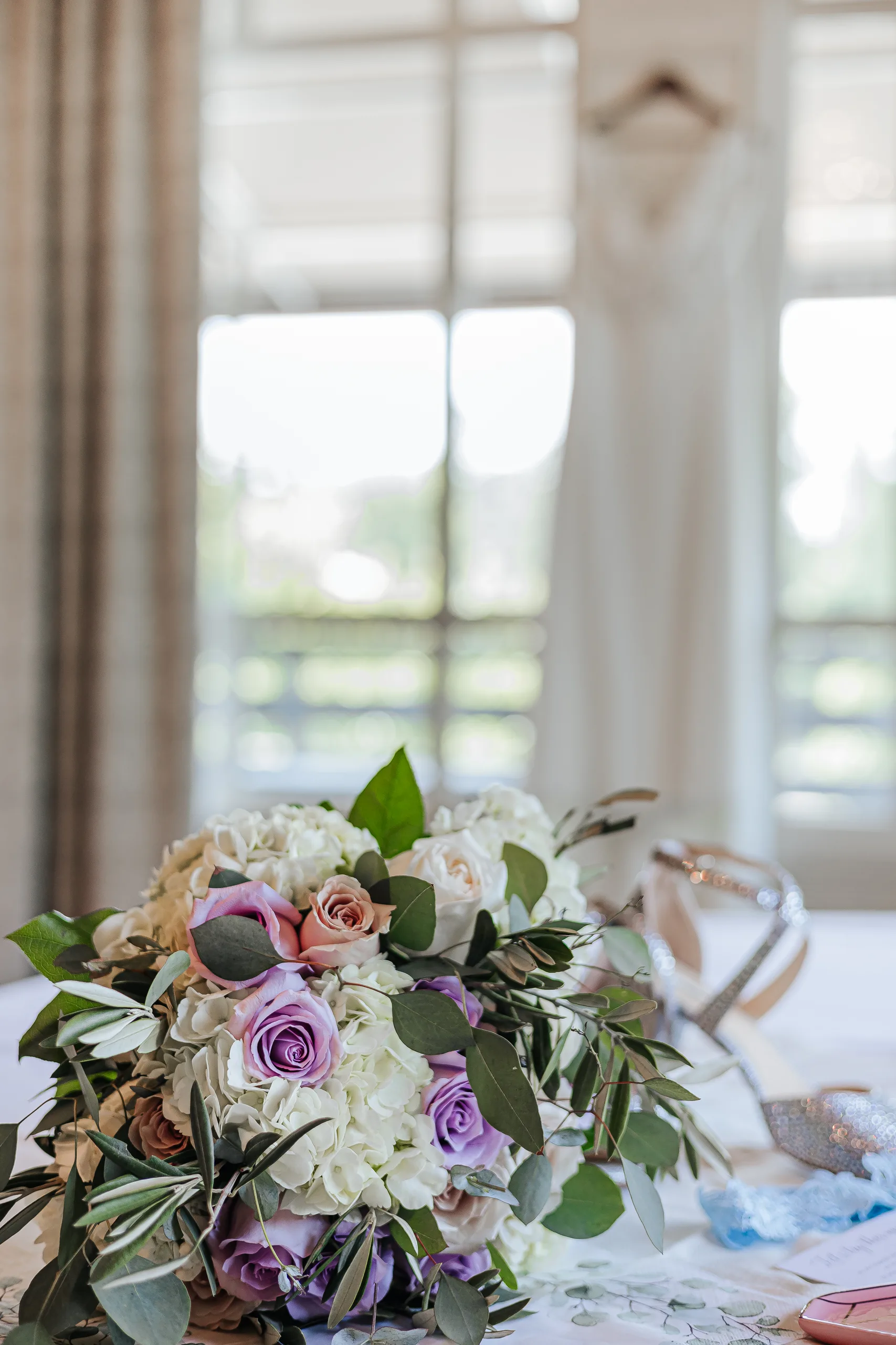 Wedding Florals: her bouquet of lavender roses and white hydrangea at a wedding at the Country Club of Roswell in Roswell, GA