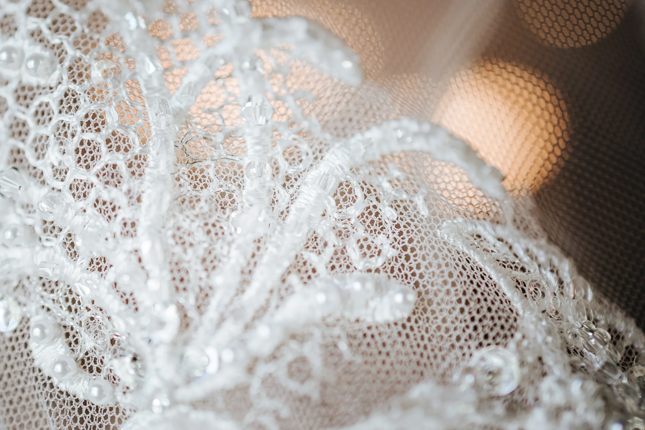 Wedding Details: the beading on her gown up close at a wedding at the Country Club of Roswell in Roswell, GA