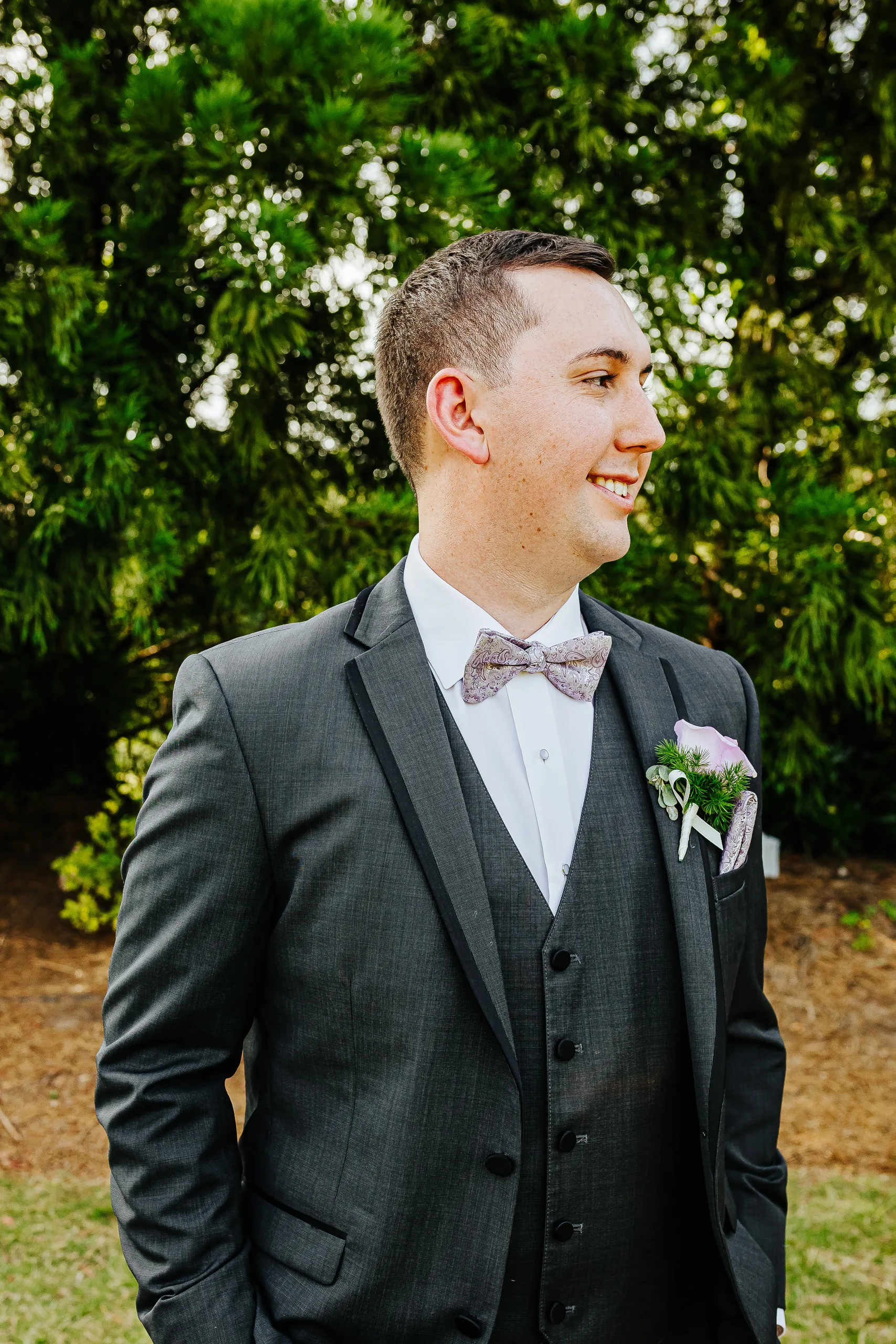 Wedding Formals: the groom smiling in his grey suit at their wedding at the Country Club of Roswell in Roswell, GA