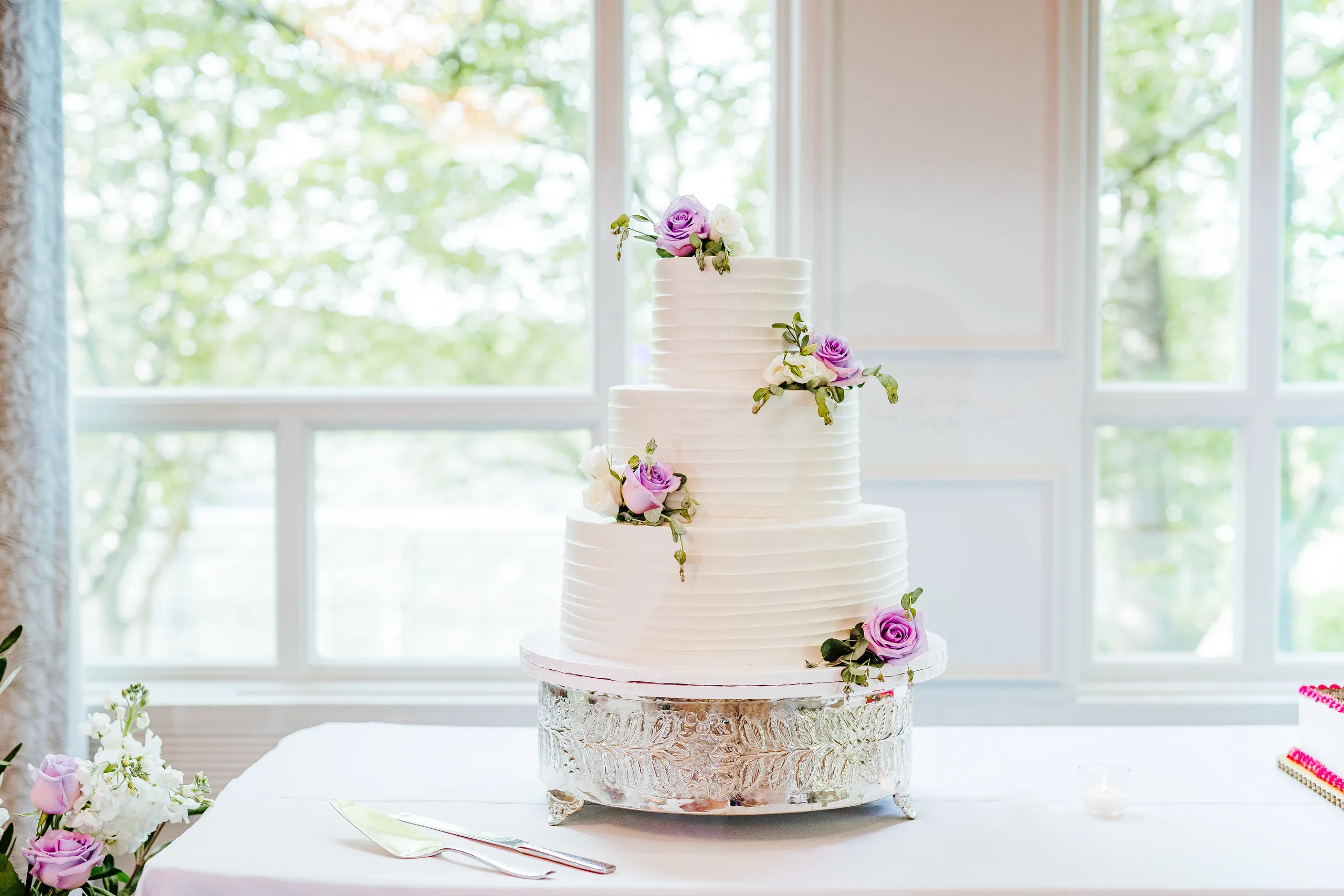 Wedding Cake Details: the wedding cake by the window at a wedding at the Country Club of Roswell in Roswell, GA