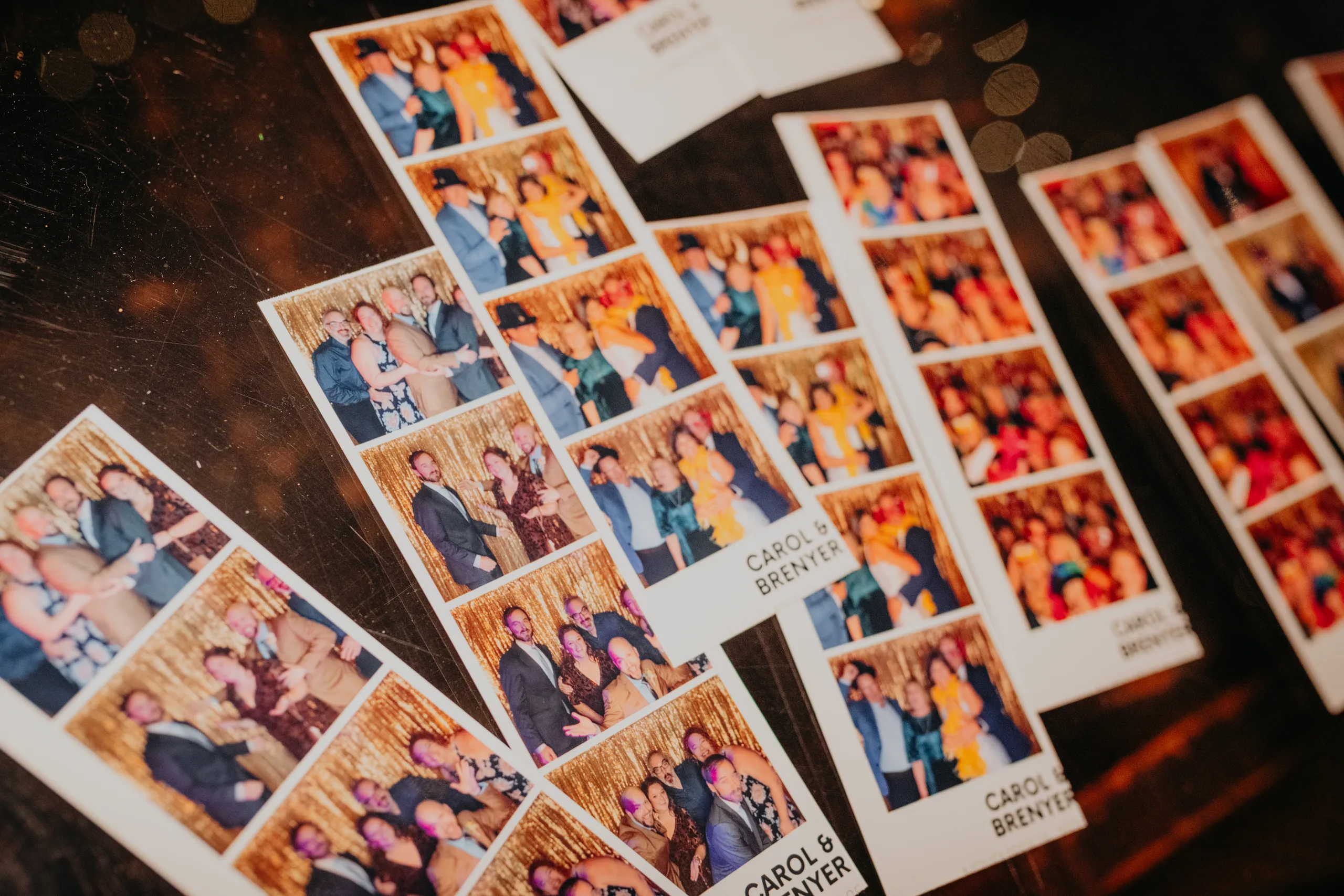 Reception Details: photo booth strips with their names, at a wedding at 550 Trackside in Lawrenceville, GA