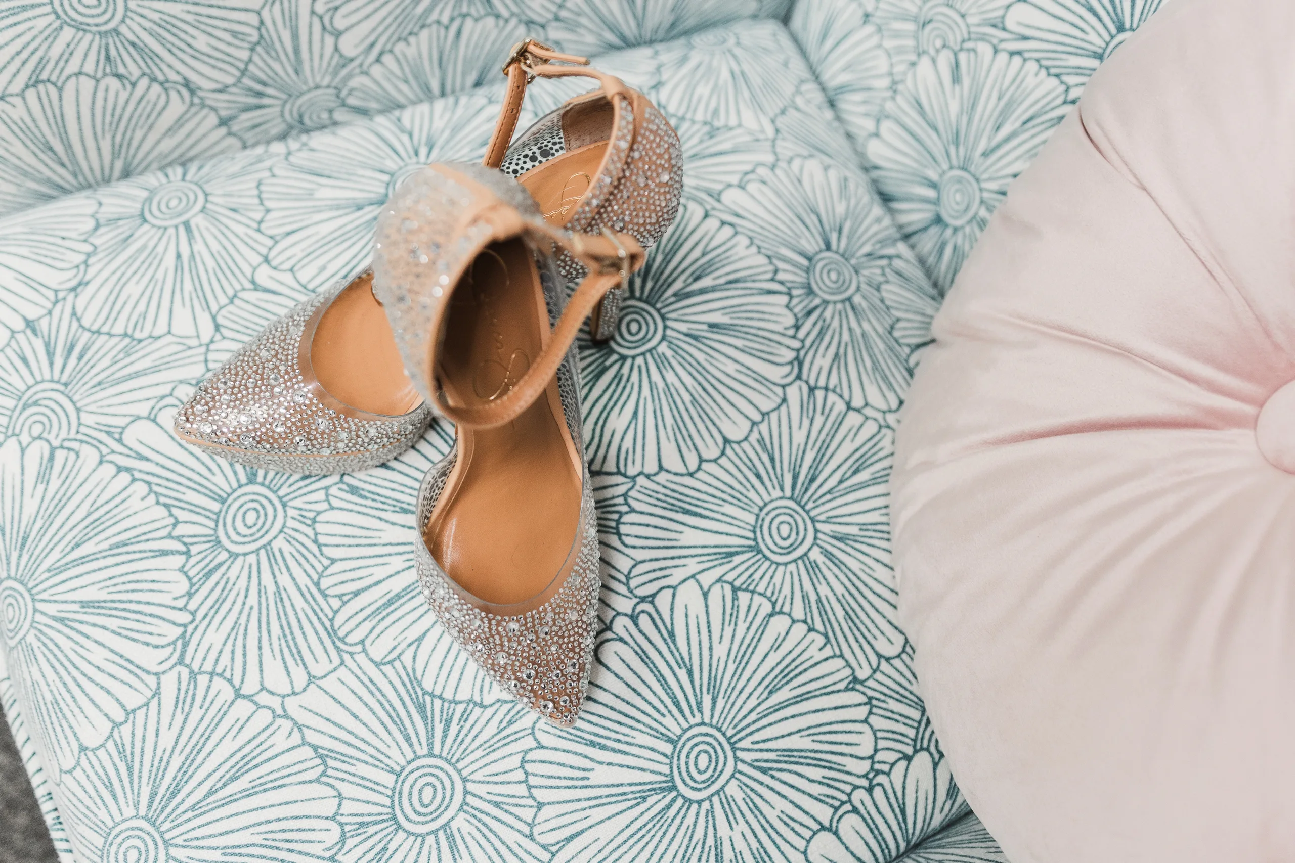 Wedding Details: her sparkly ankle strap heels on a patterned chair, at a wedding at the Historic DeKalb Courthouse in Decatur, GA
