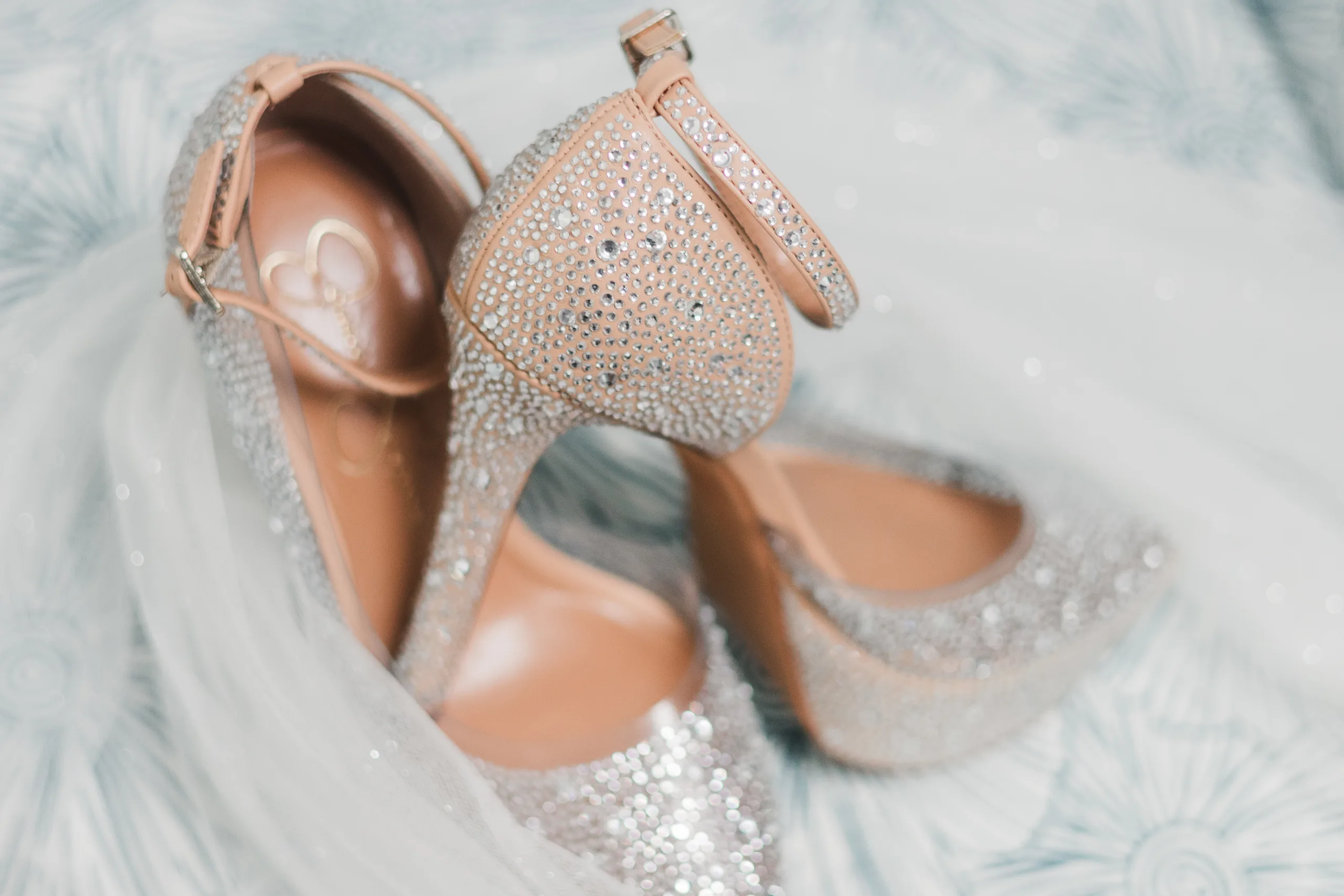 Wedding Details: her sparkly heels on her veil, at a wedding at the Historic DeKalb Courthouse in Decatur, GA