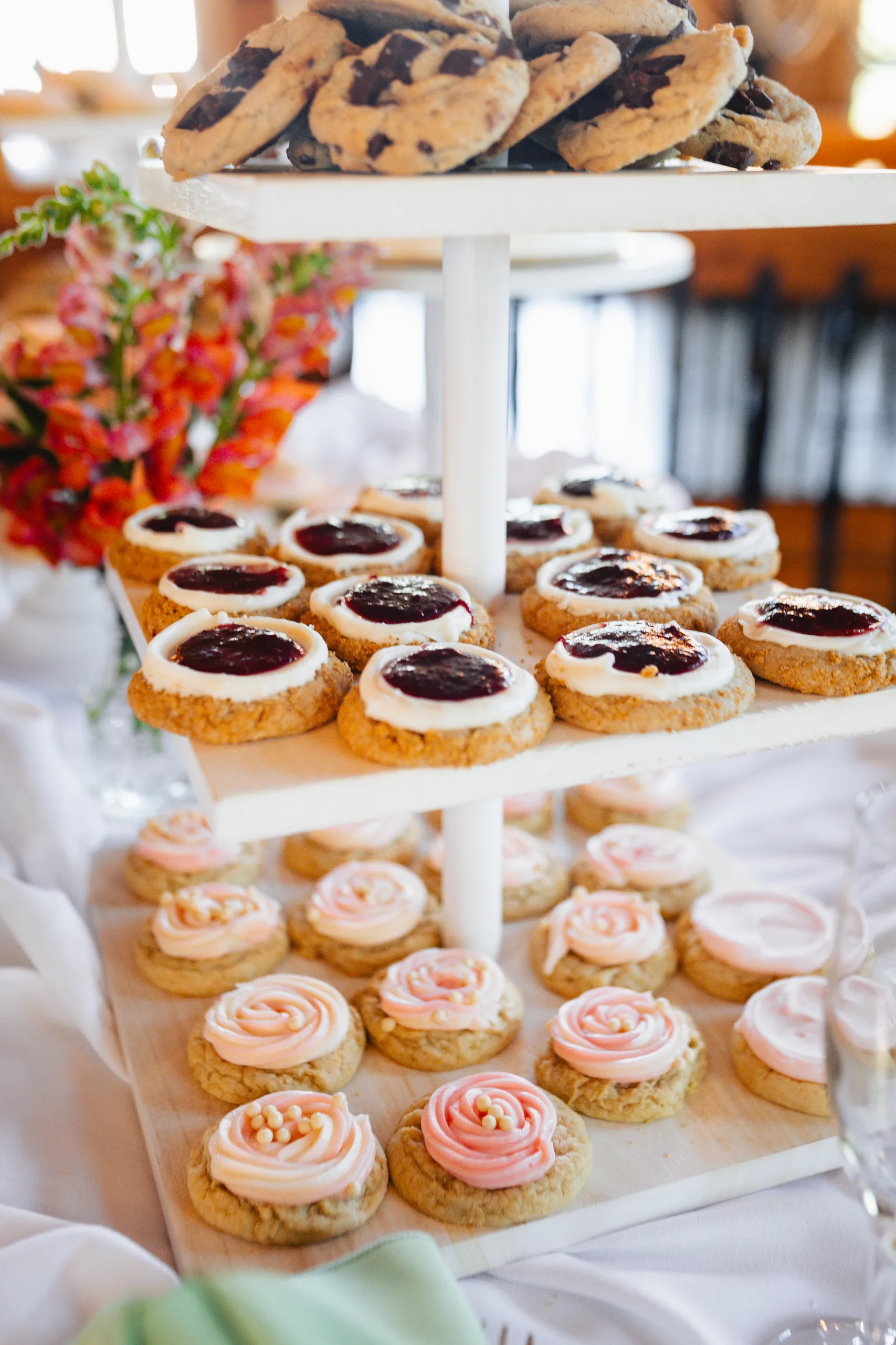 Reception Details: a tower of Crumbl cookies at a wedding at Ivy Hall at Roswell Mill in Roswell, GA